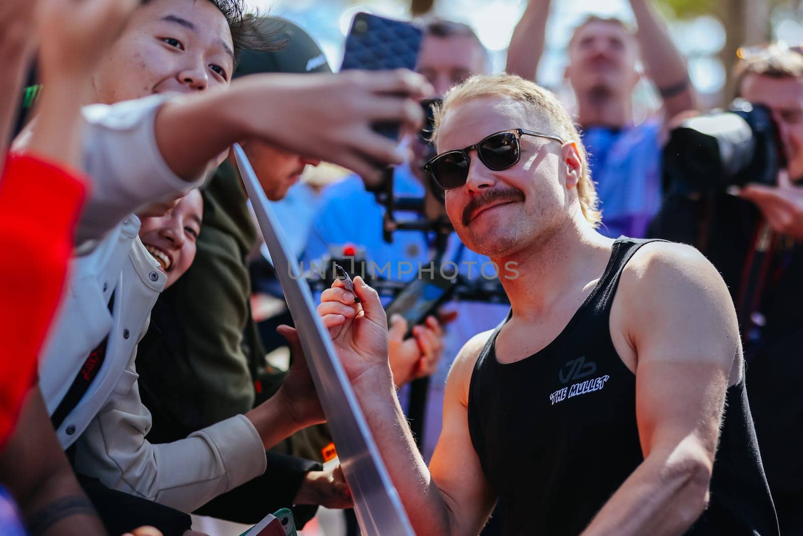 MELBOURNE, AUSTRALIA - MARCH 30: Valtteri Bottas of Finland meets fans at the 2023 Australian Formula 1 Grand Prix on 30th March 2023