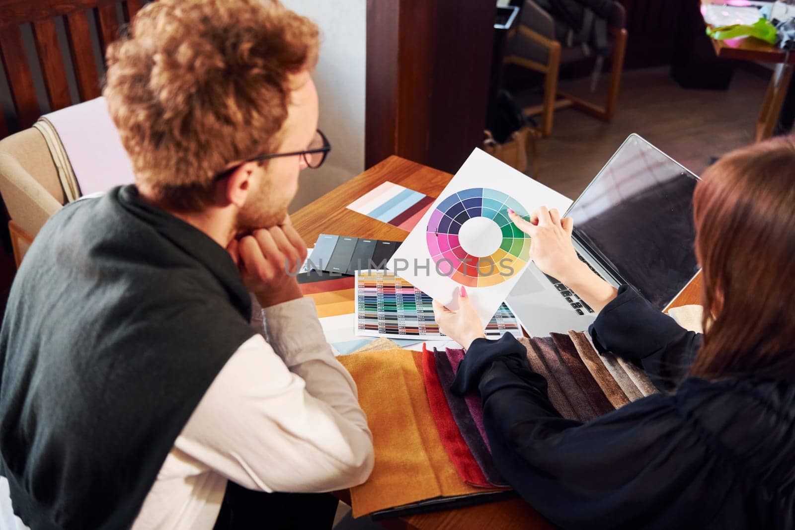 Business people working with documents. Indoors of new modern luxury restaurant.