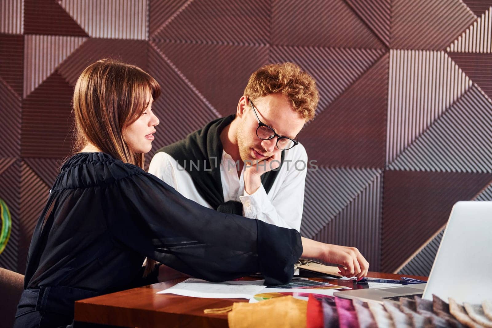 Business people working with documents. Indoors of new modern luxury restaurant.