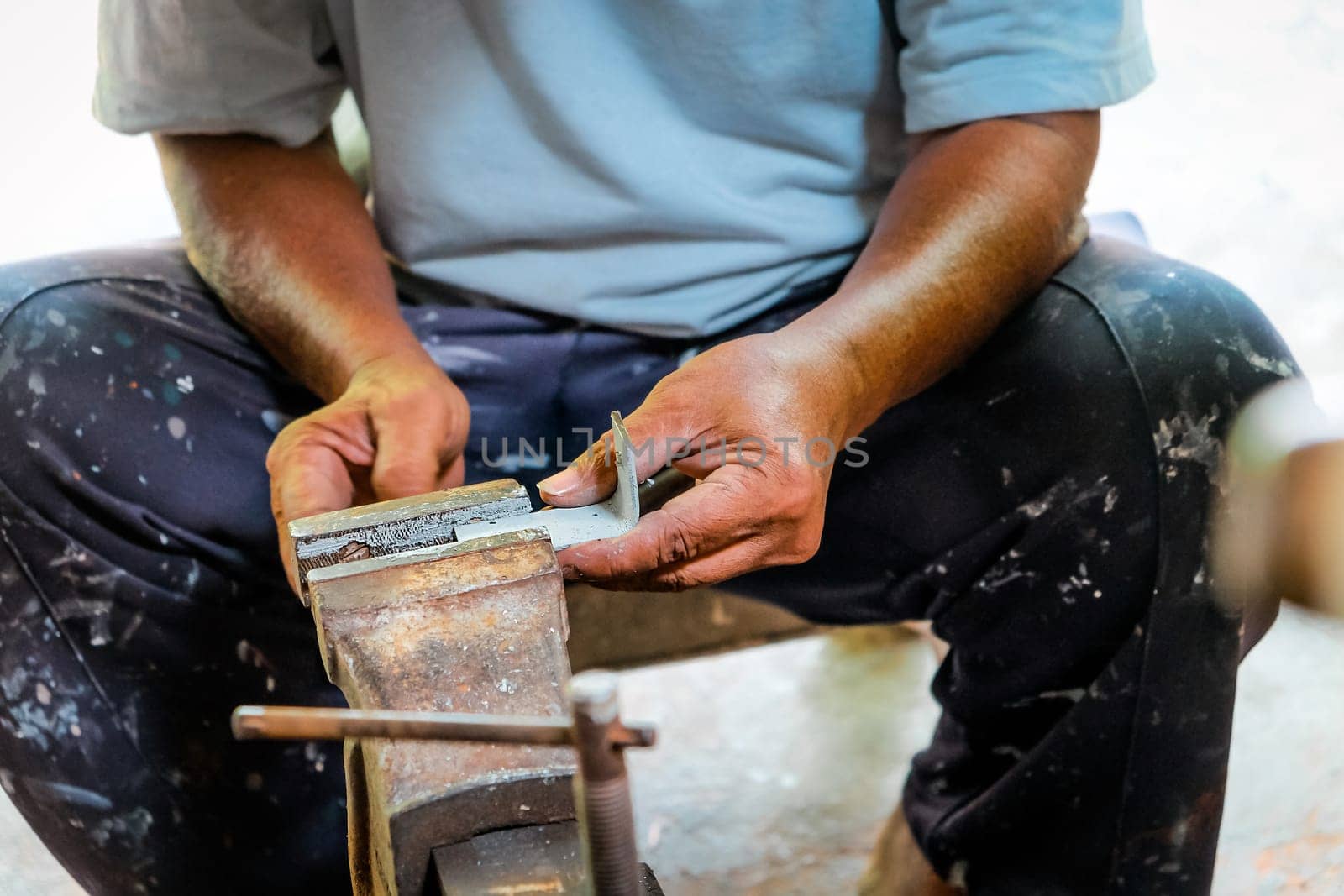 Metalworker working in workshop by ponsulak