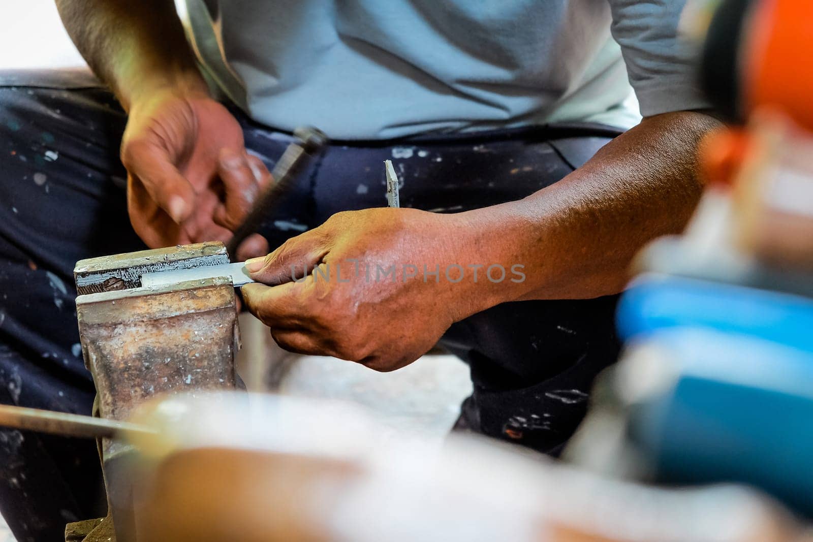 Metalworker working in workshop by ponsulak