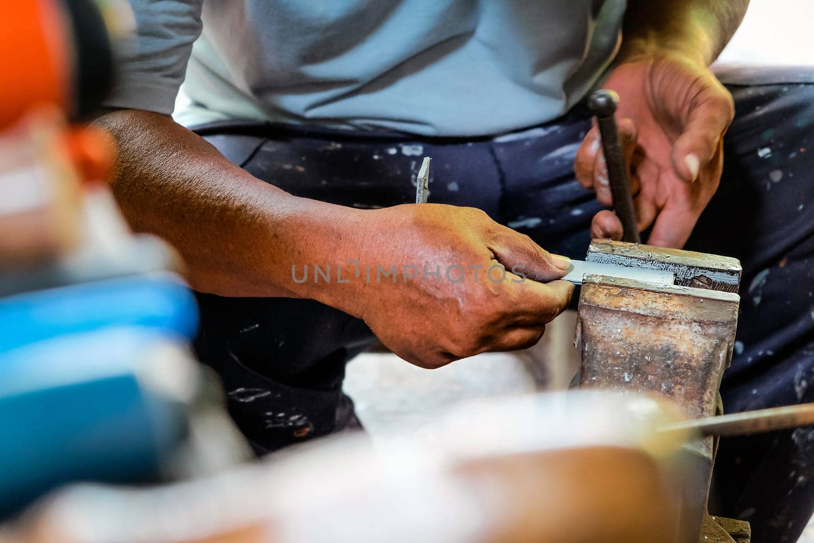 Metalworker working in workshop by ponsulak