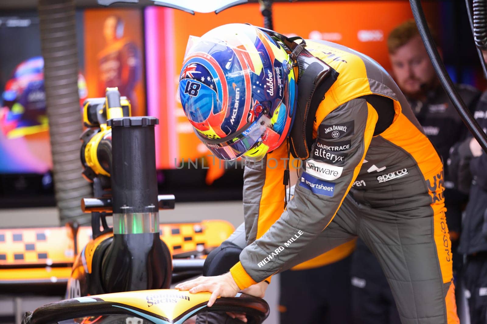 MELBOURNE, AUSTRALIA - MARCH 31: Oscar Piastri of Australia gets into the McLaren MCL36 during practice in the 2023 Australian Grand Prix at Albert Park in Melbourne, Australia