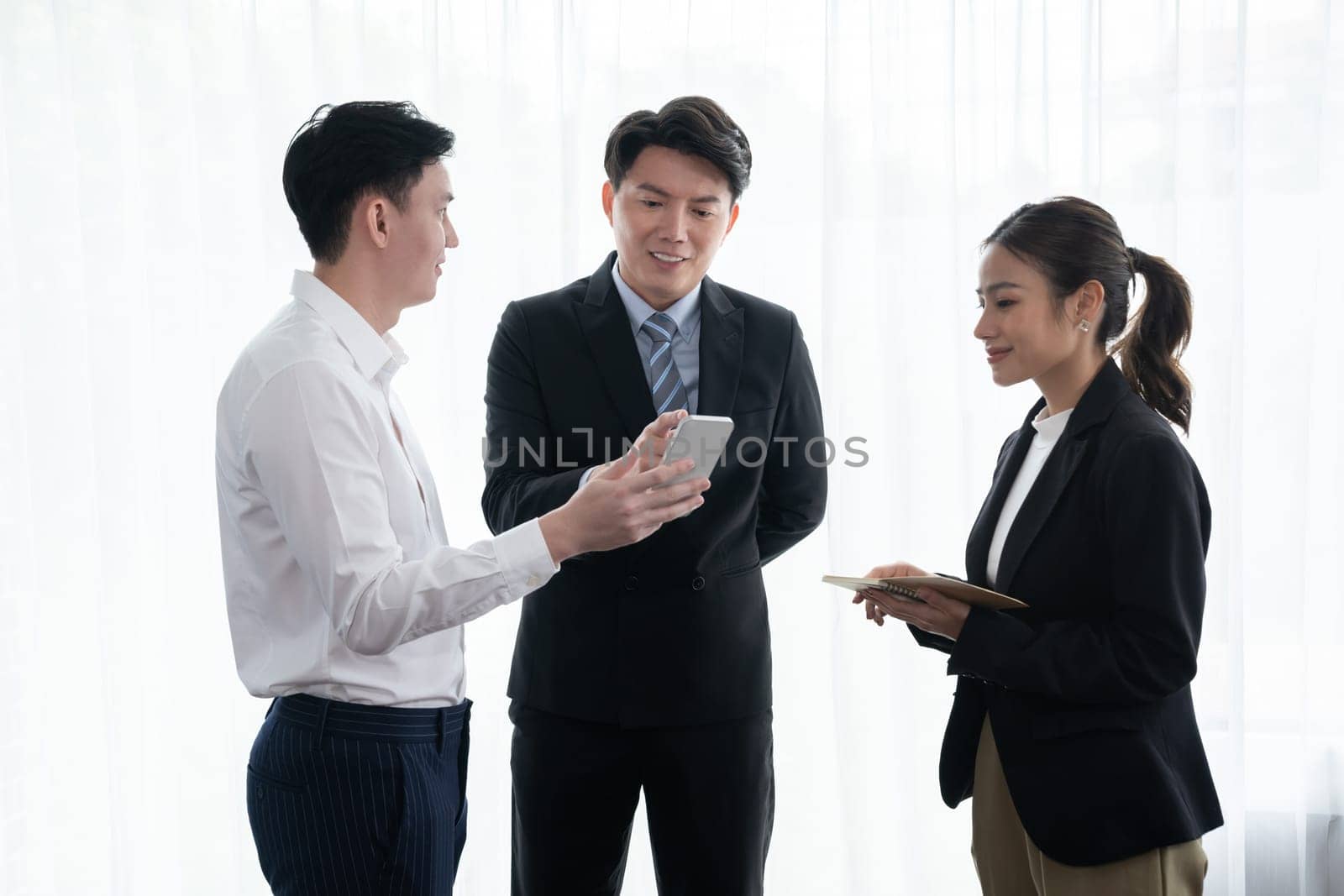 Manager advice younger colleagues in workplace as concept of harmony in office. by biancoblue