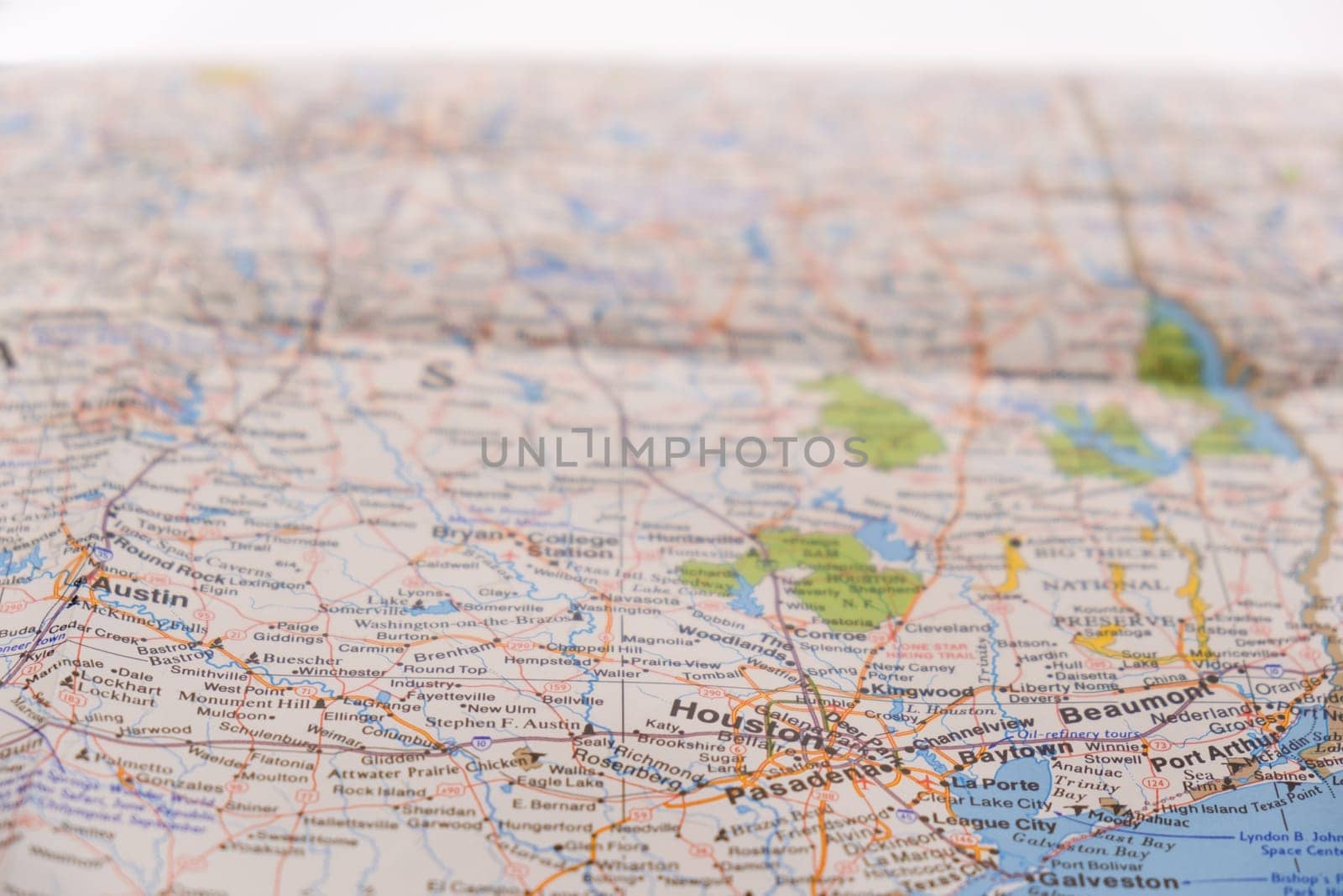 Close up detail of a colorful map focusing on Houston Texas through selective focus, background blur