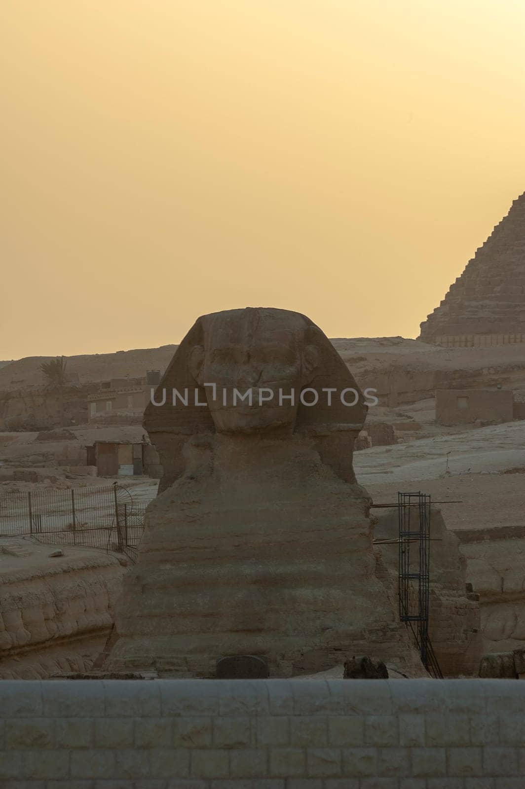 Giza, Egypt - April 13 2008: Sphinx and pyramids (Cheops and Khafre) in the archeological site of Giza. Egypt.