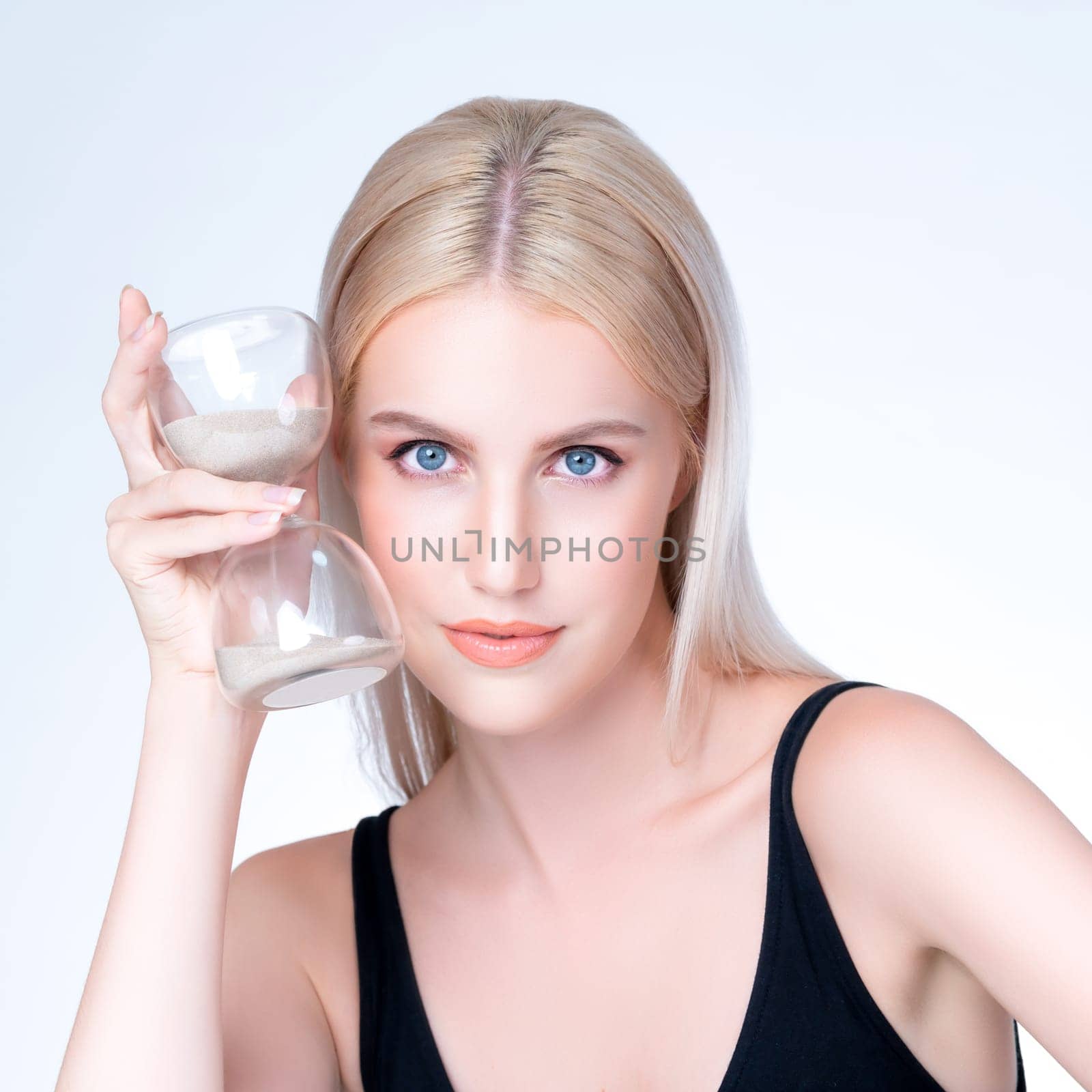 Personable beautiful woman with hourglass anti-aging as skincare concept by biancoblue
