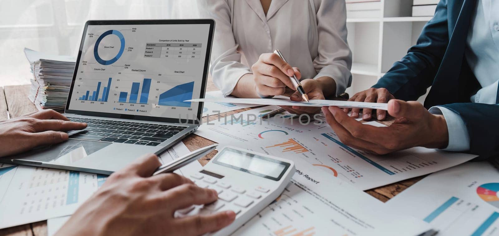 Business financial, accountant discussing with partner are meeting to audit finance planning sales to meet targets set in next year. stock market concept.. by wichayada