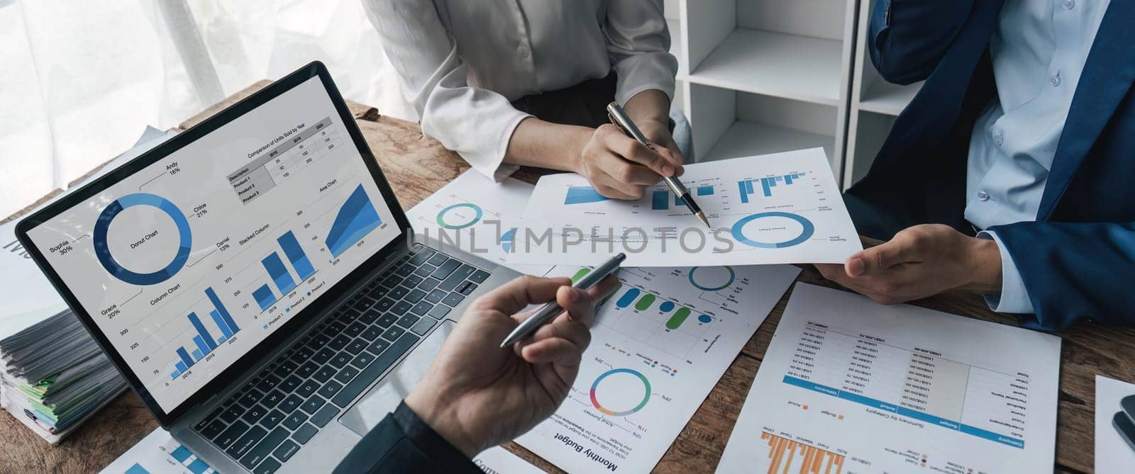 Business financial, accountant discussing with partner are meeting to audit finance planning sales to meet targets set in next year. stock market concept.. by wichayada