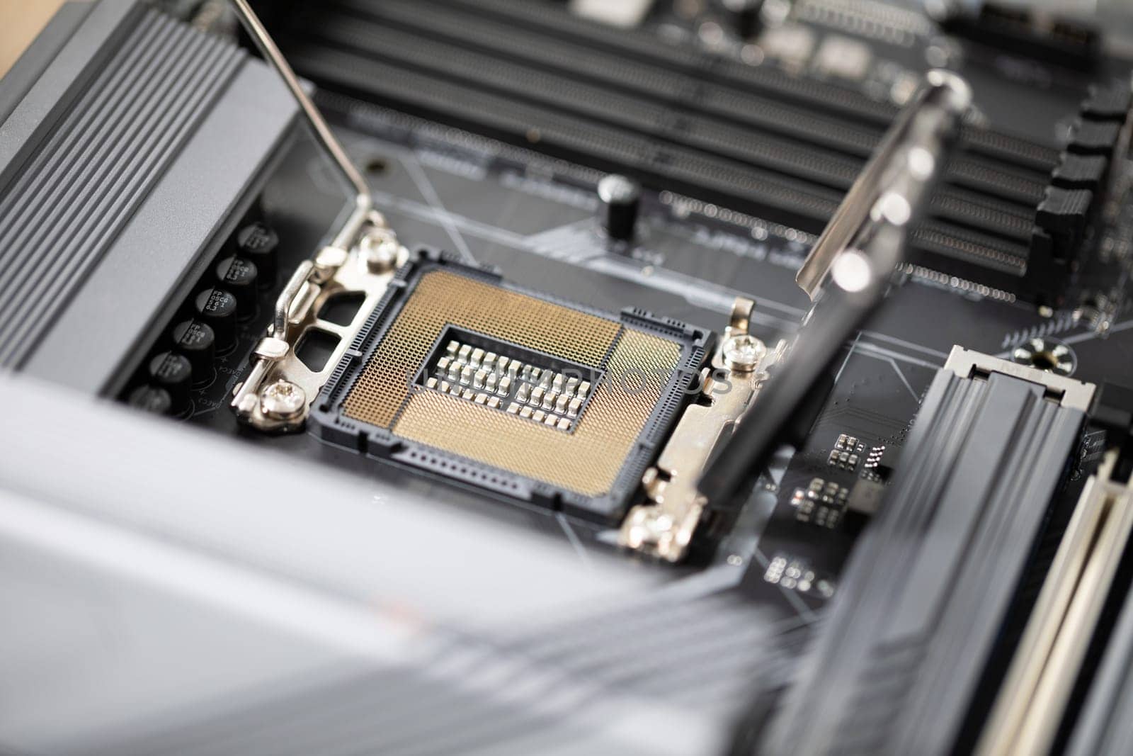 Replacing computer parts. Close-up of the computer motherboard. Laptop repair by a professional. Replacement of computer parts to improve the quality of use.