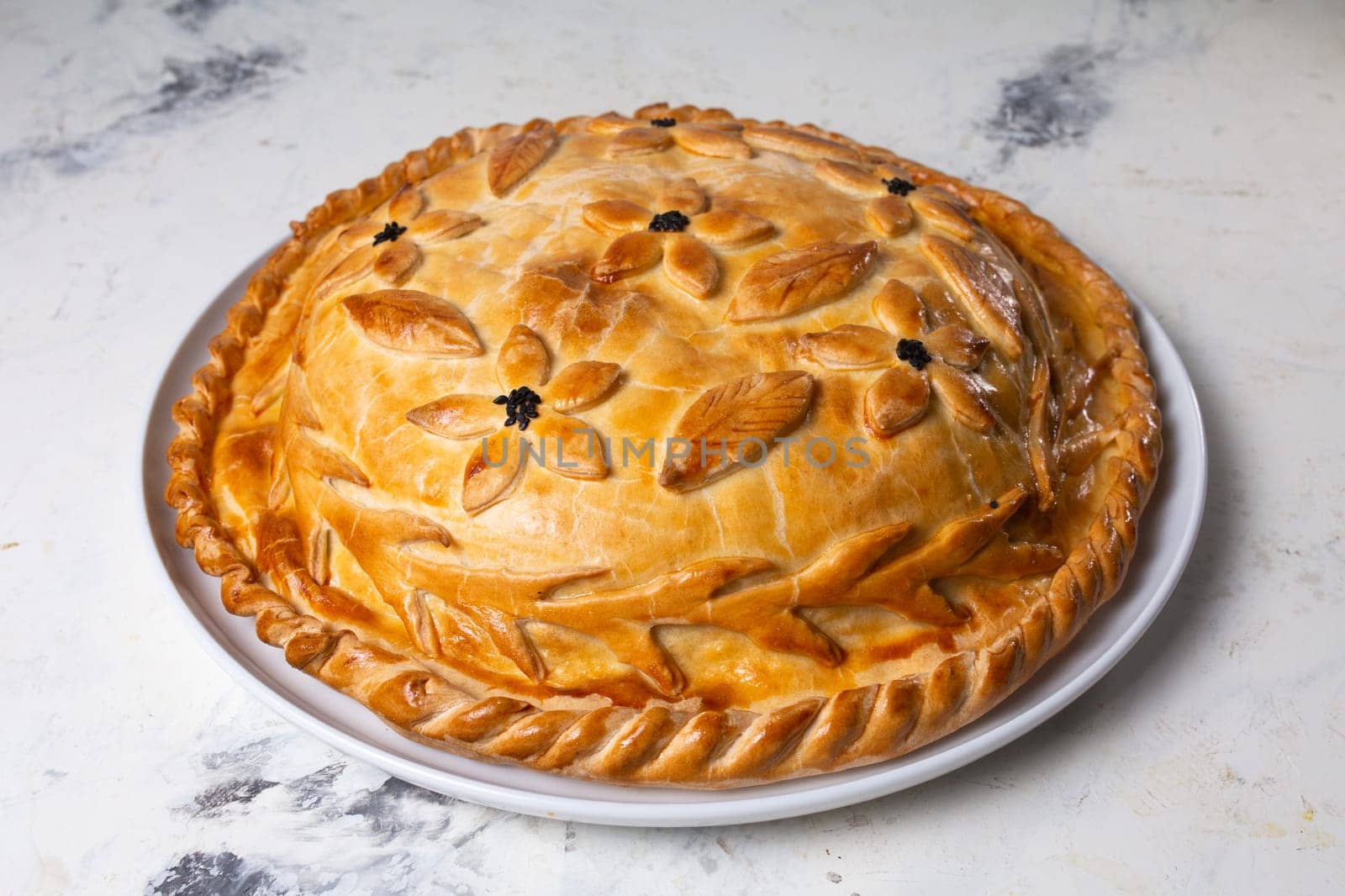 hot homemade pie on the table. pie with filling.