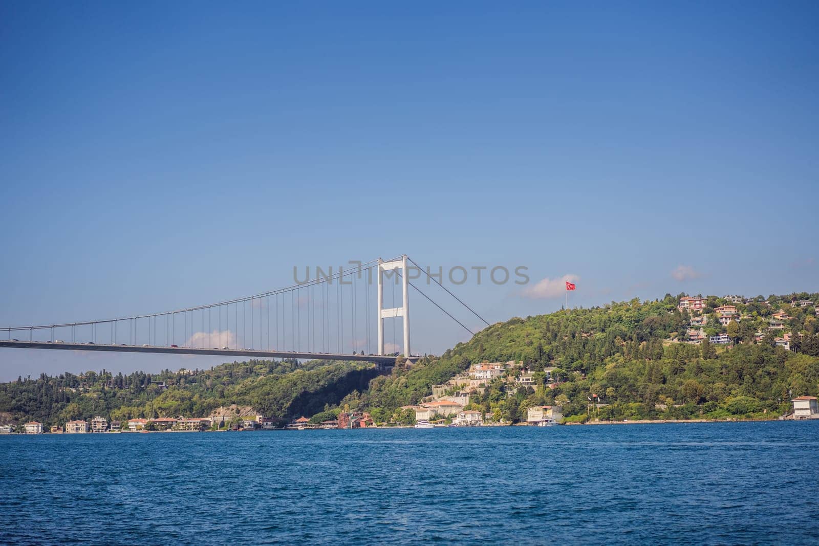 Turkey, Istanbul, houses below Fatih Sultan Mehmet Bridge on Bosphorus Strait by galitskaya