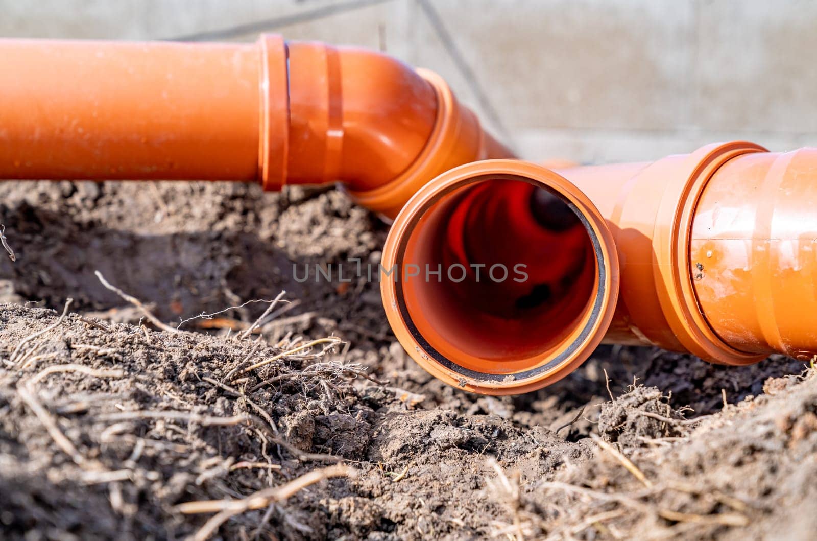 PVC plastic pipe for sewerage in the ground.