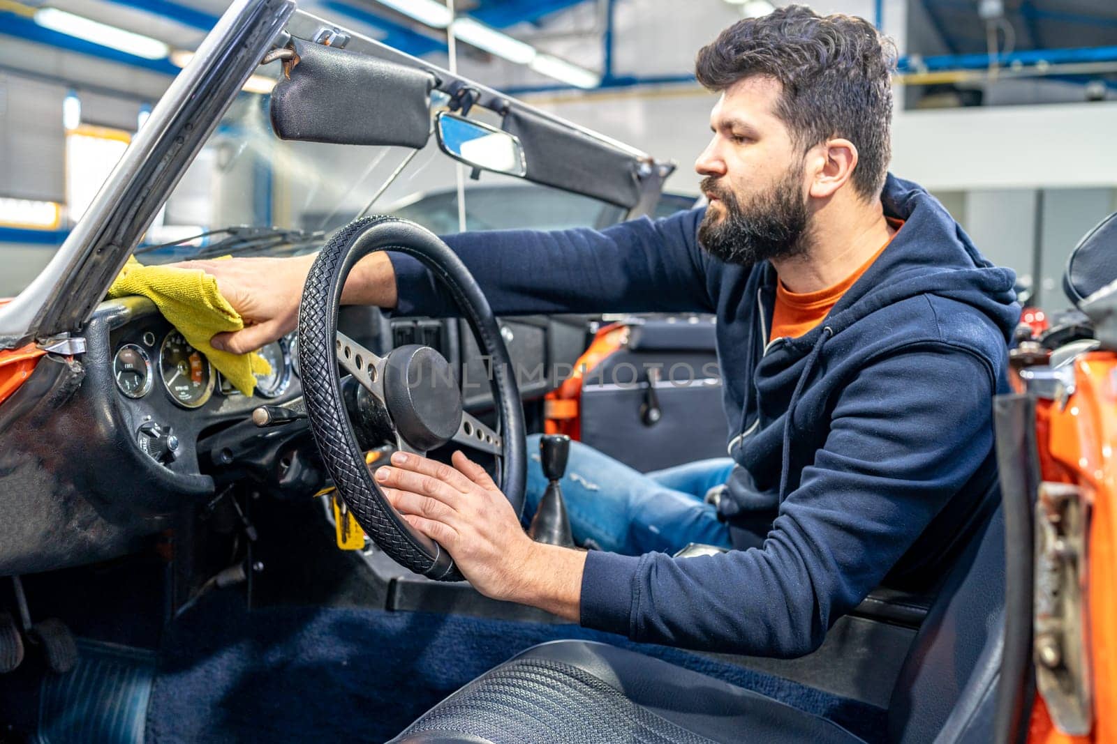 manual cleaning of the interior of an old car. High quality photo