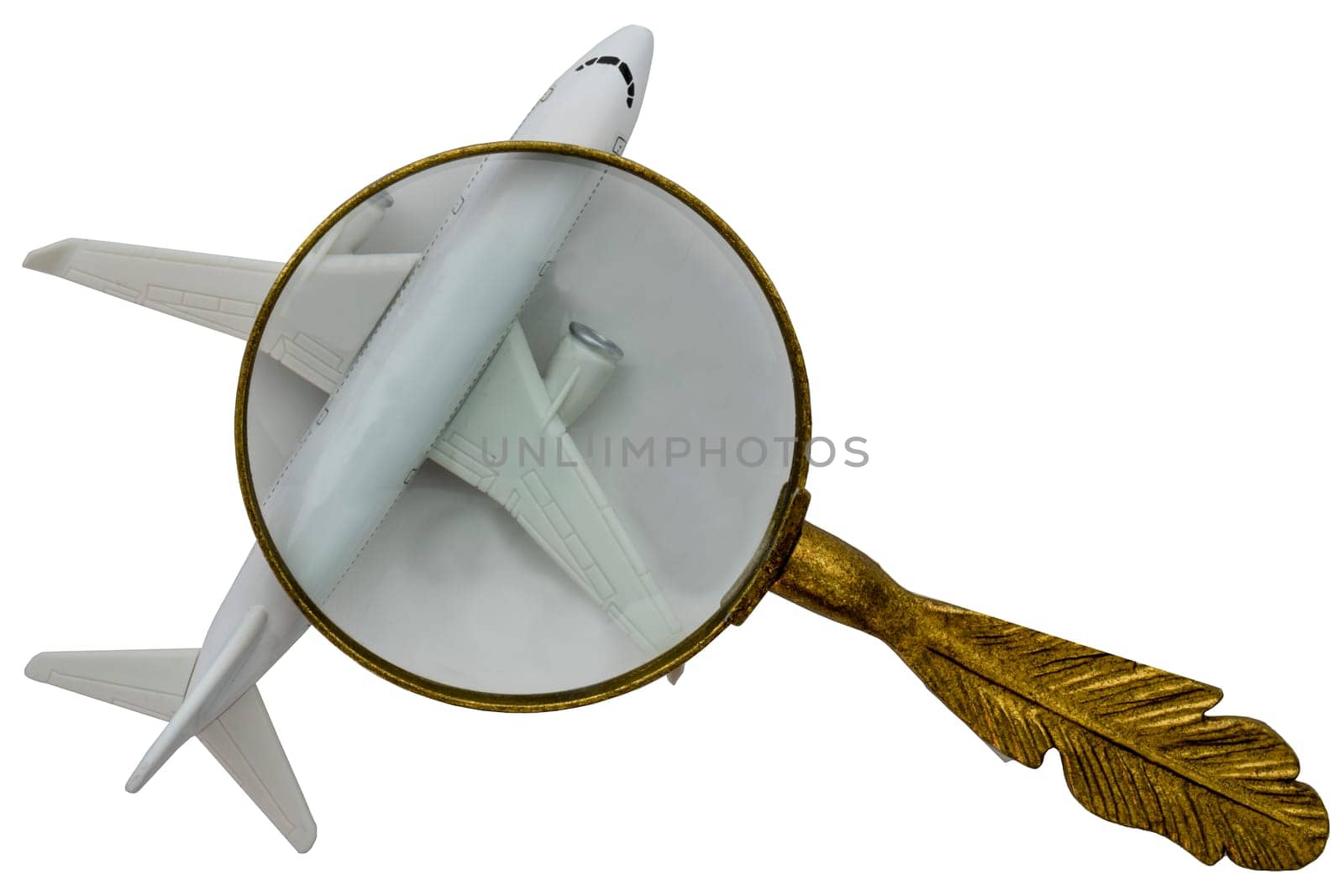 Gold handled magnifying glass showing close up of a white airplane on a white background, clipping path. High quality photo