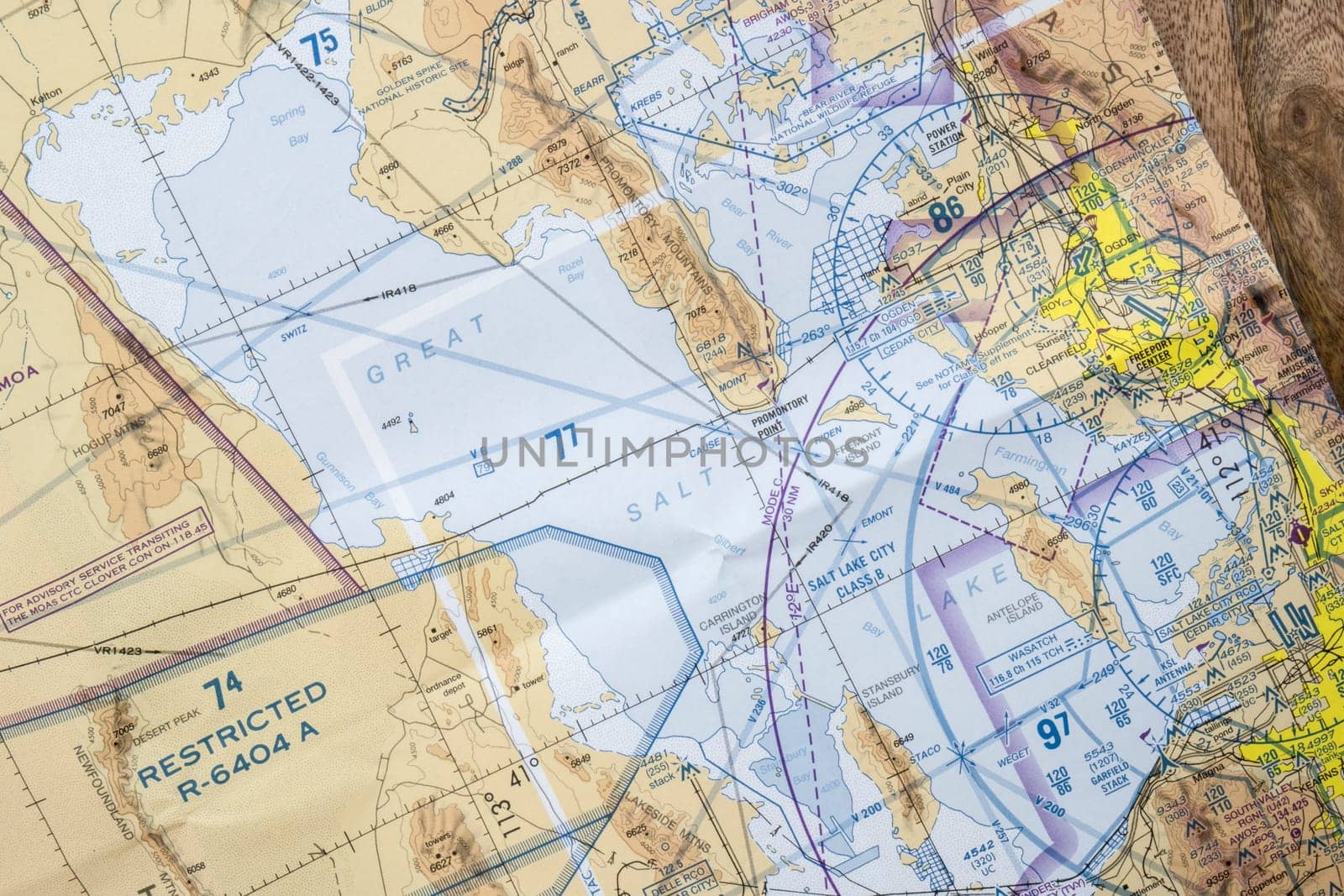 Close up of an FAA aviation sectional navigation map showing airport approach to Salt Lake City International airport, restricted airspace