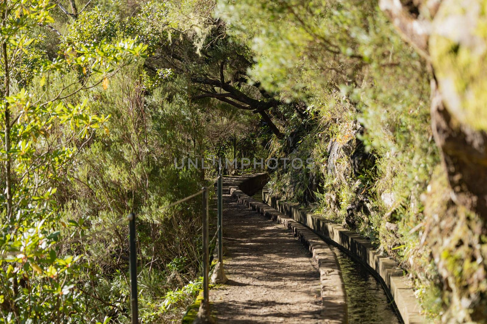 Irrigation canal with hiking path through the mountains at Madeira Island, Portugal