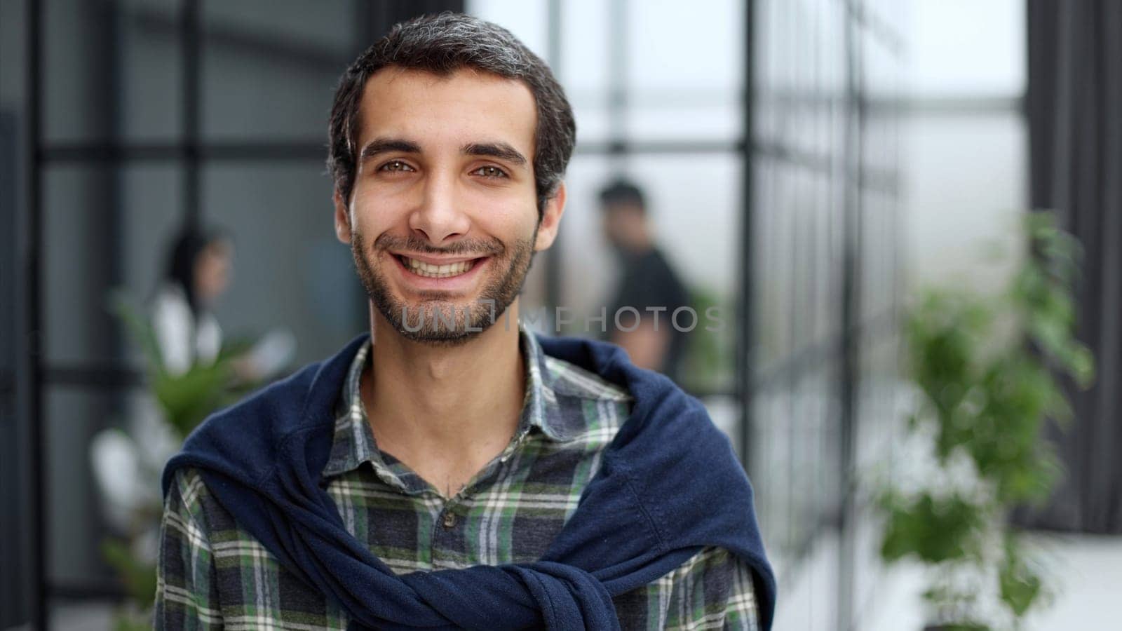Portrait of a positive cheerful confident freelancer feeling successful in casual wear