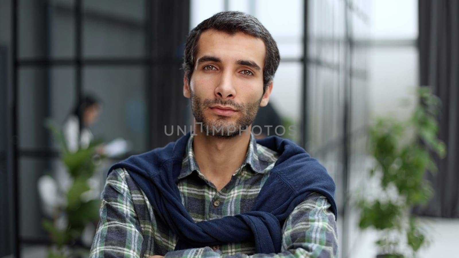 Portrait of a positive cheerful confident freelancer feeling successful in casual wear