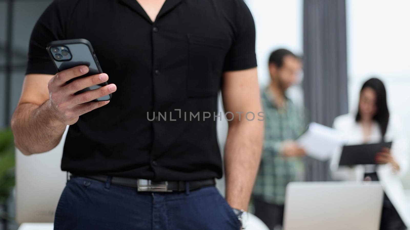 Modern gadget. Close-up of a smartphone screen in the hands of a businessman.