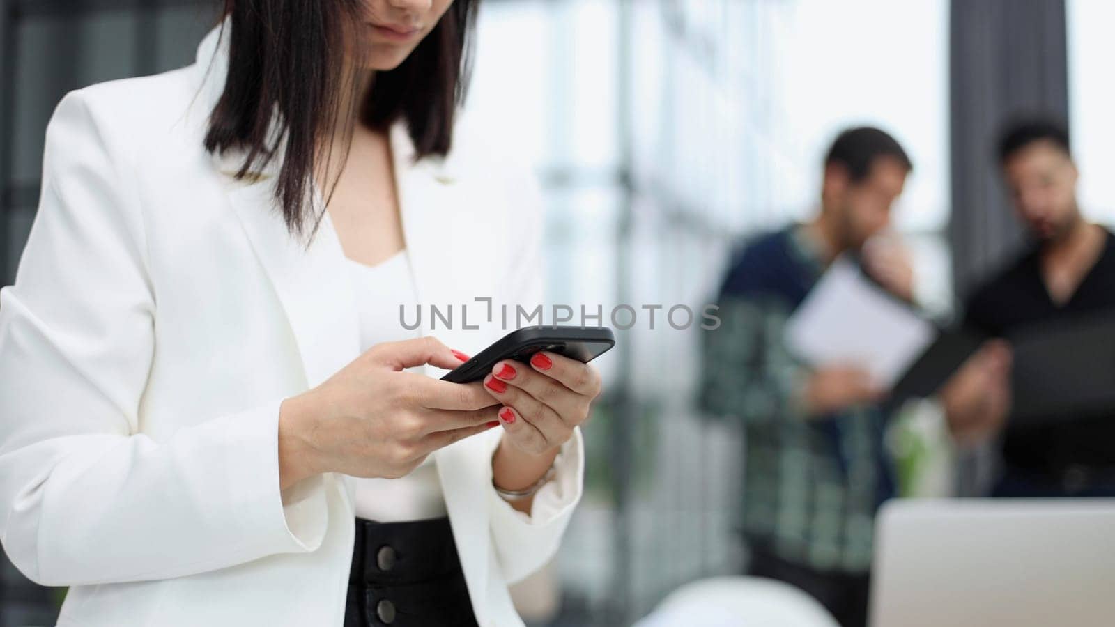 Modern gadget. Close-up of a smartphone screen in the hands of a business woman.