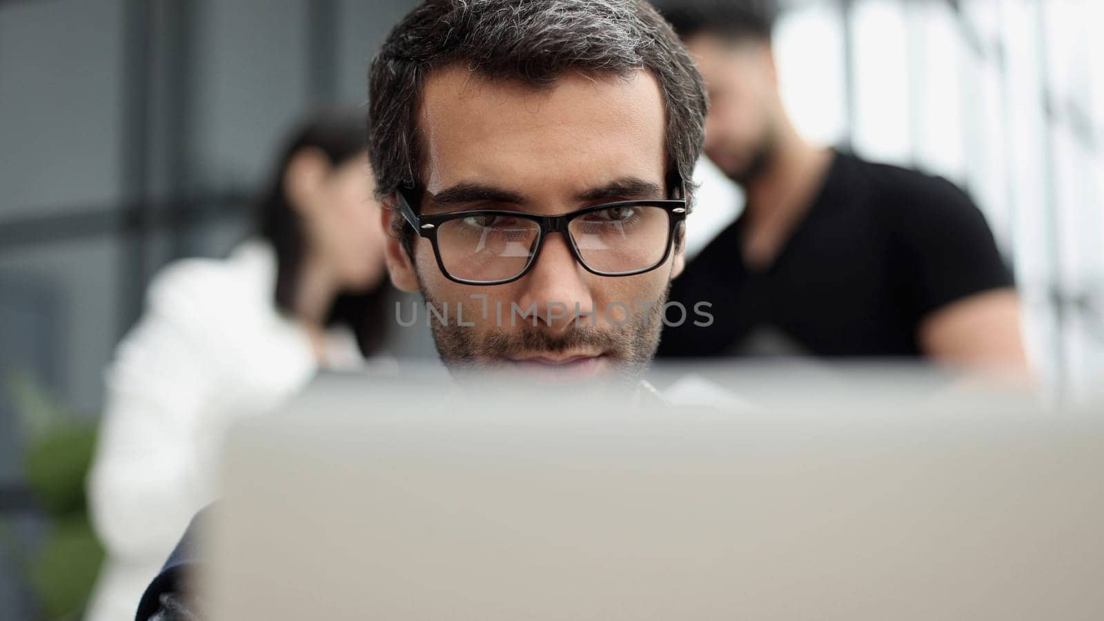 Young man working in a modern office