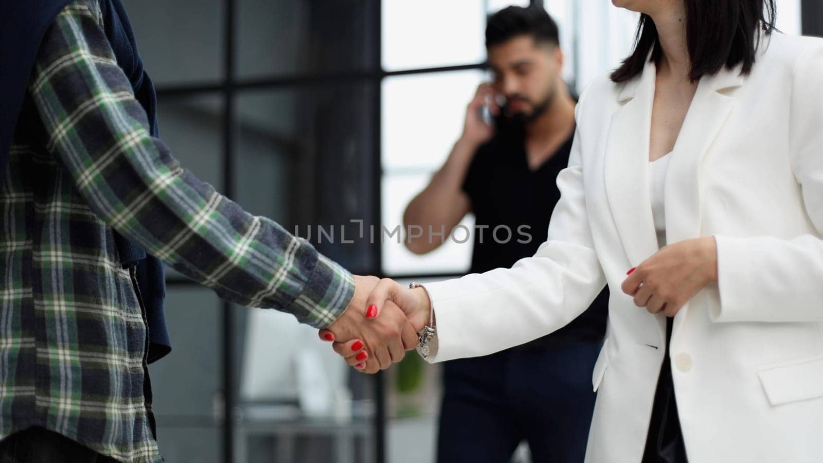 manager shaking hands with satisfied male client after successful business meeting during break