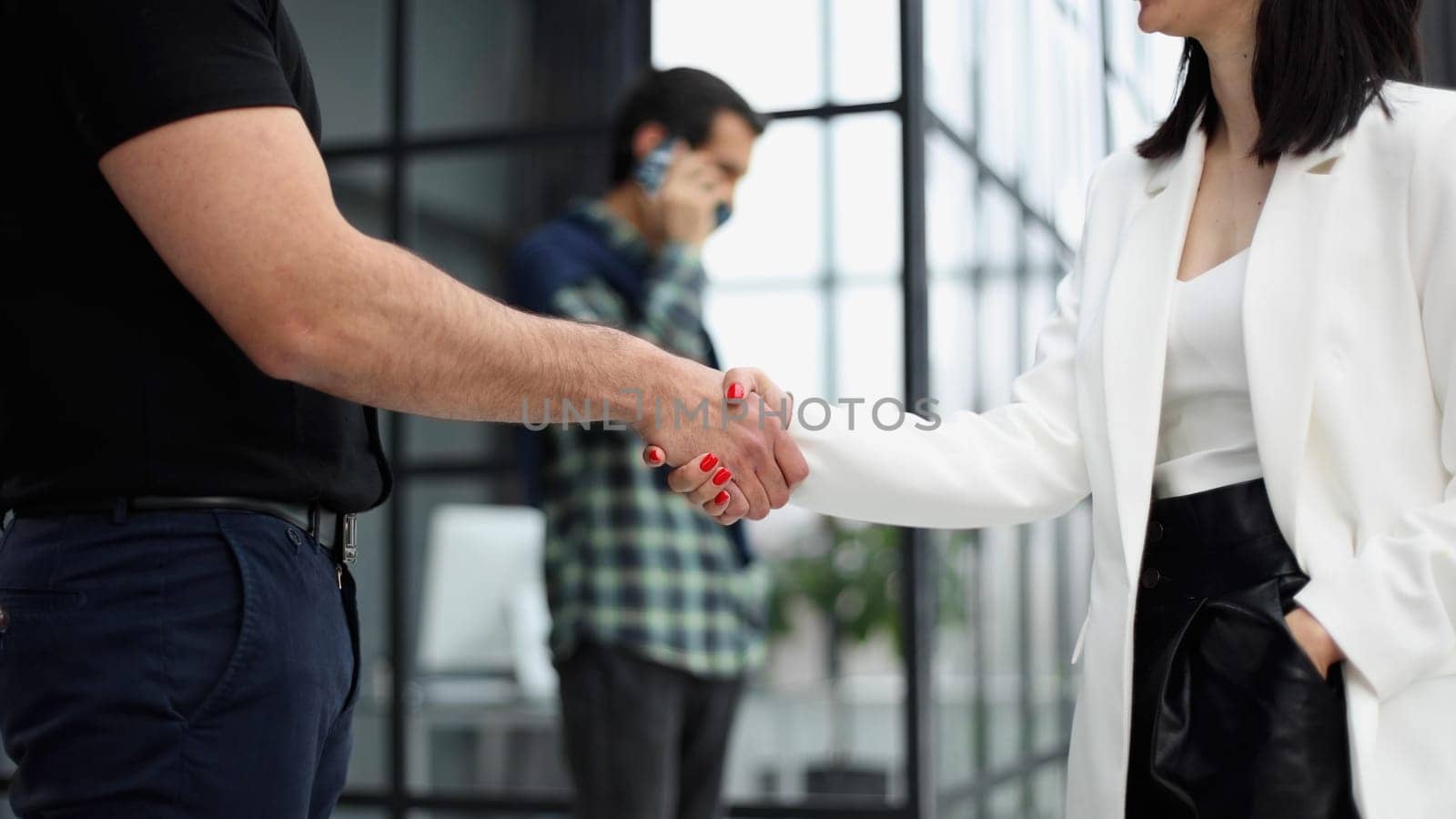 manager shaking hands with satisfied male client after successful business meeting during break