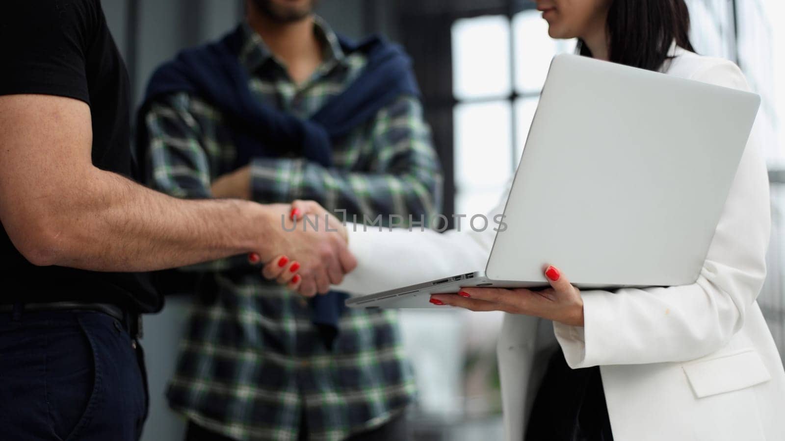 Close-up of two business people shaking hands