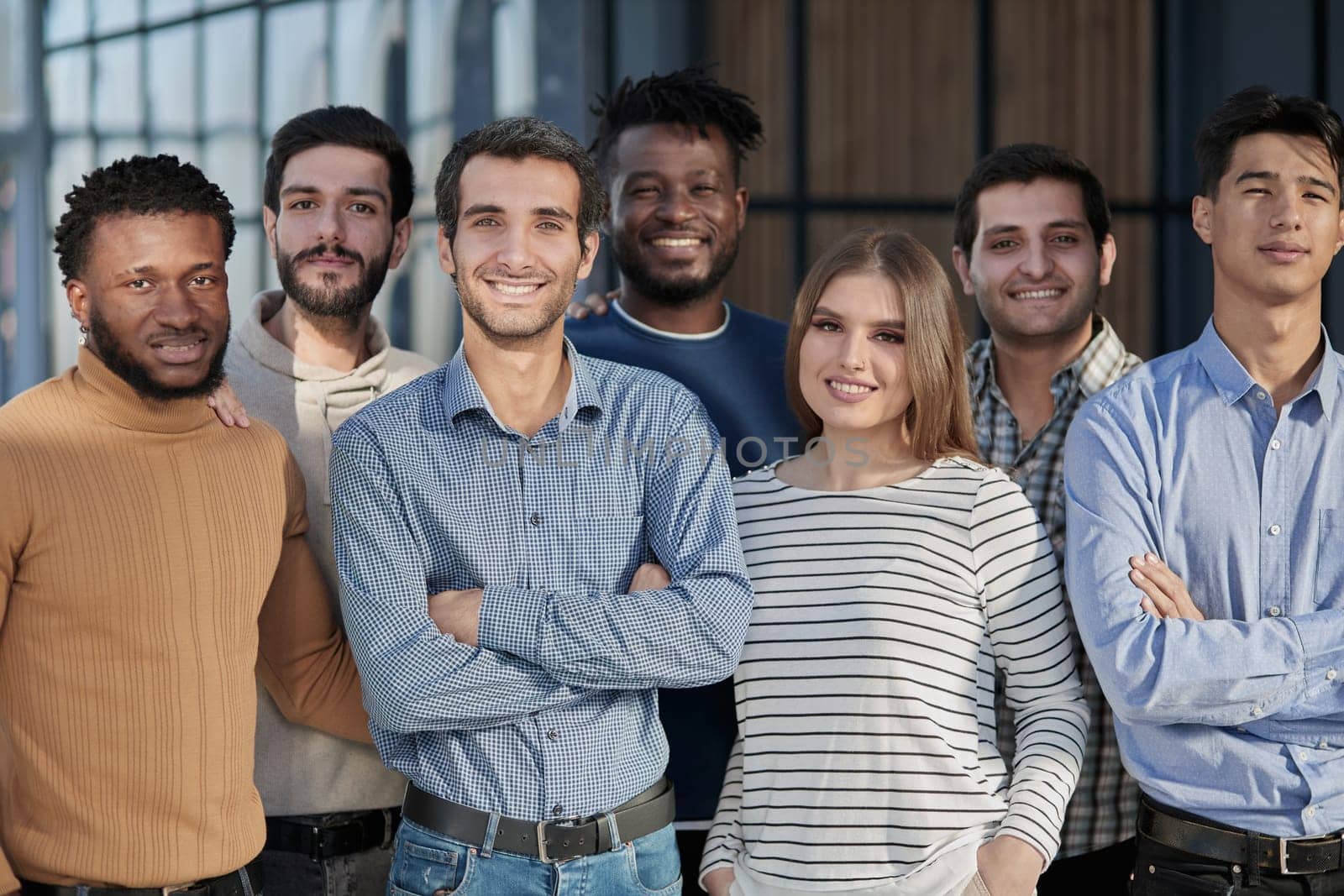 Everybody brings a different skill to the team. Portrait of a diverse group of coworkers standing in an office.