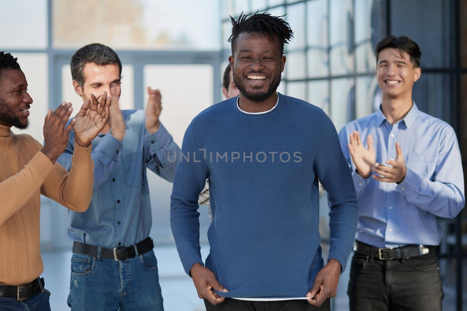 happy multiracial colleagues coworkers celebrate business success together