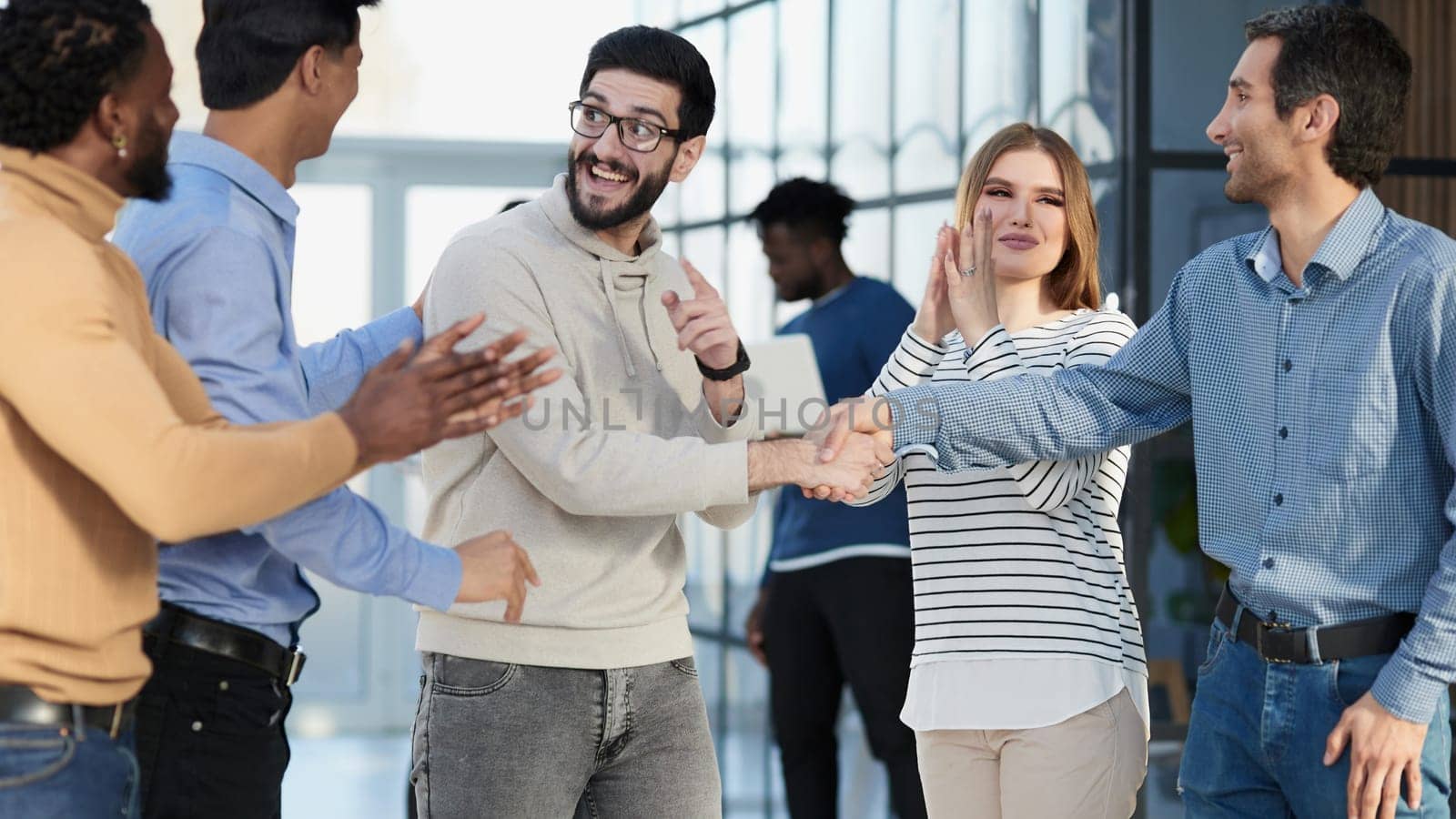 Group of successful architects standing at conference hall at office