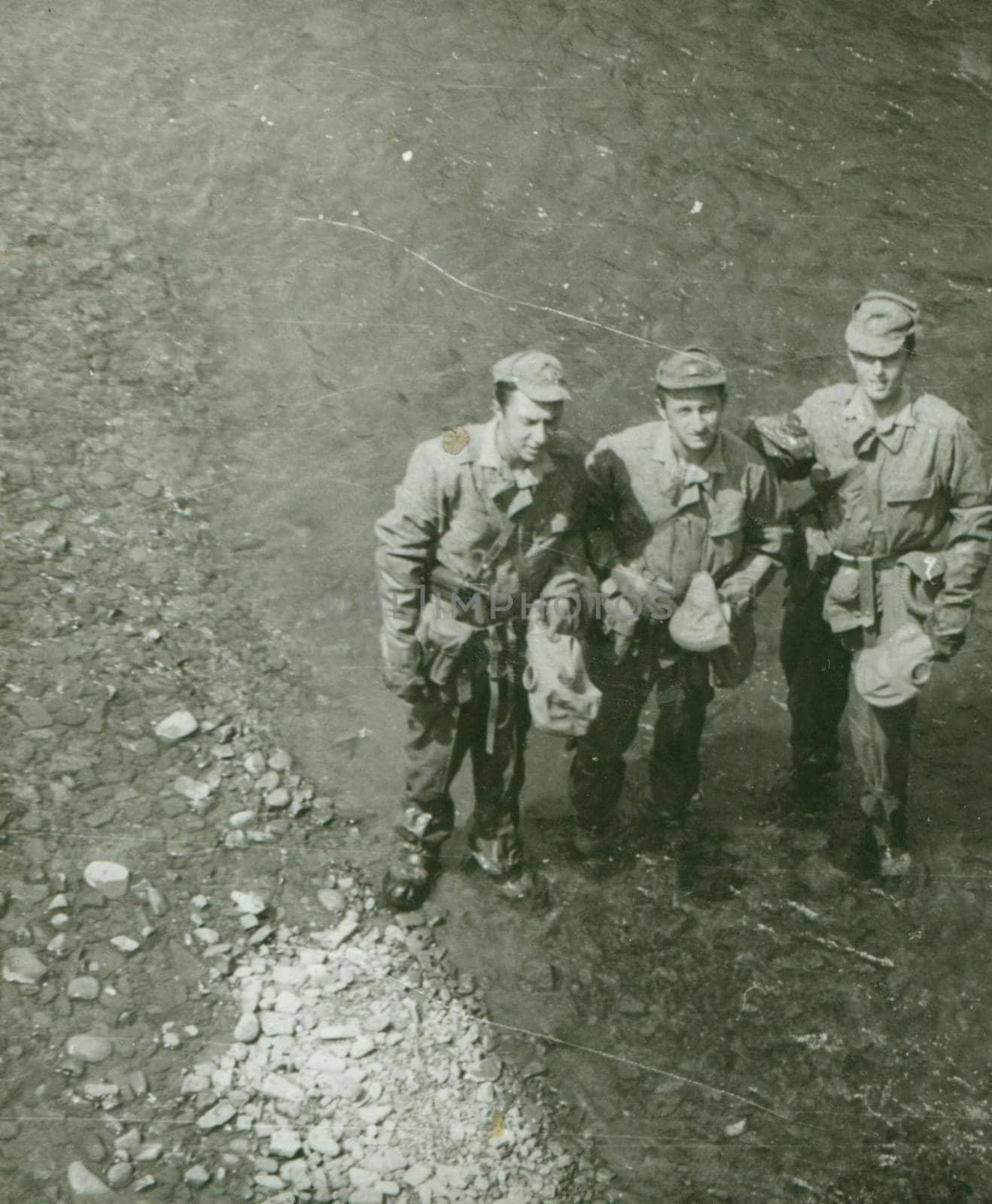 THE CZECHOSLOVAK SOCIALIST REPUBLIC - CIRCA 1970s: Retro photo shows young men soldiers during army drill. Soldiers with gas masks. Vintage photography. Circa 1970.