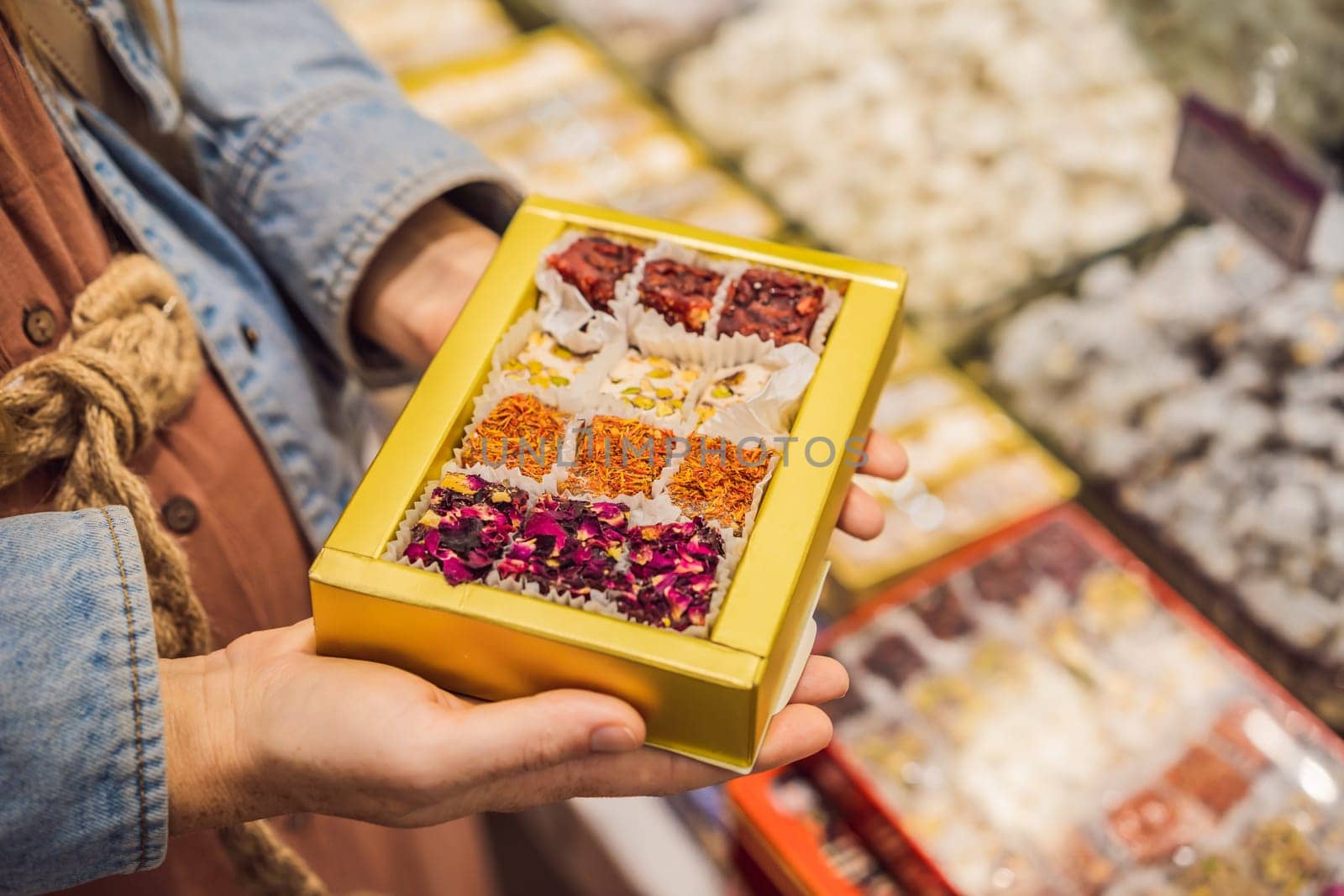 Traditional oriental sweet pastry cookies, nuts, dried fruits, pastilles, marmalade, Turkish desert with sugar, honey and pistachio, in display at a street food market.