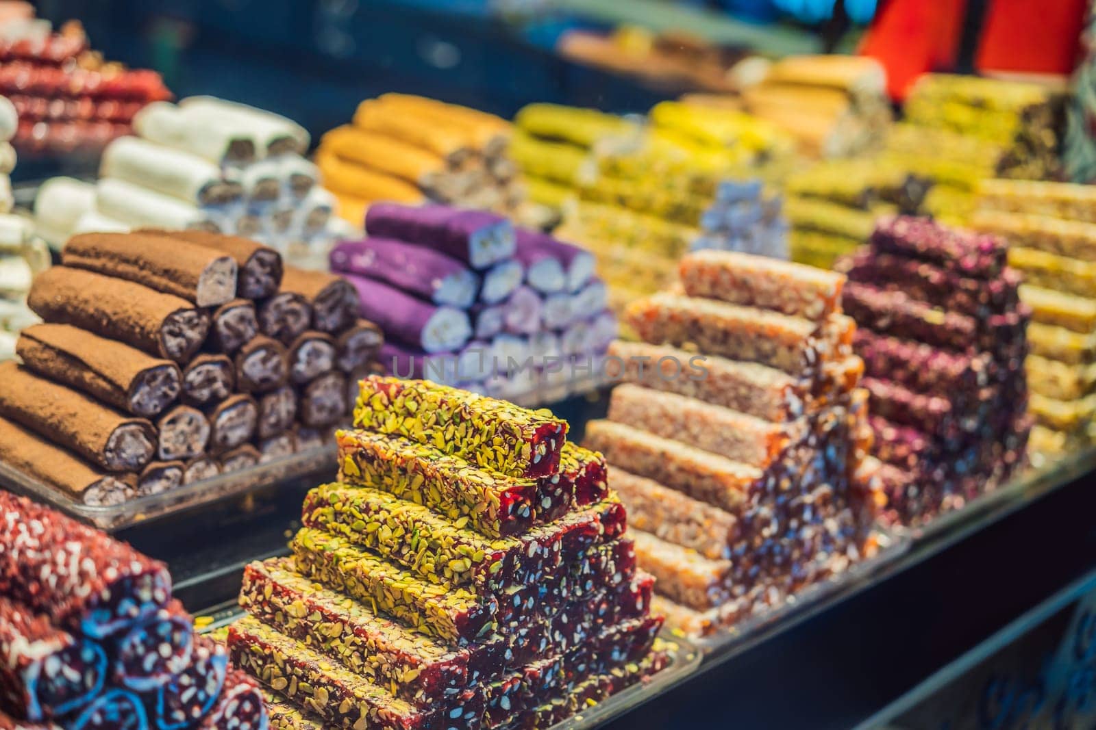 Traditional oriental sweet pastry cookies, nuts, dried fruits, pastilles, marmalade, Turkish desert with sugar, honey and pistachio, in display at a street food market by galitskaya