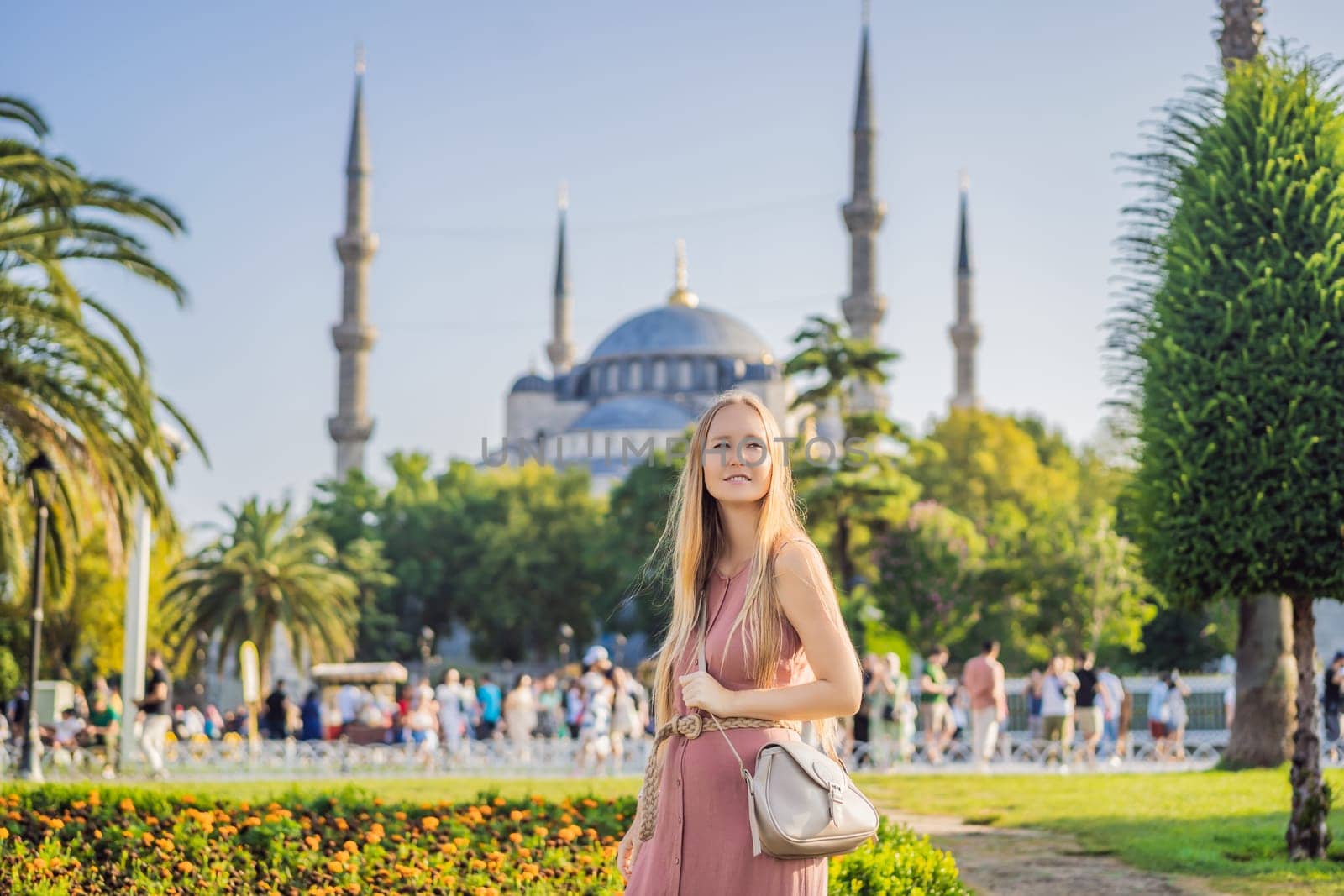 Woman tourist enjoying the view Blue Mosque Sultanahmet Camii Istanbul, Turkey.