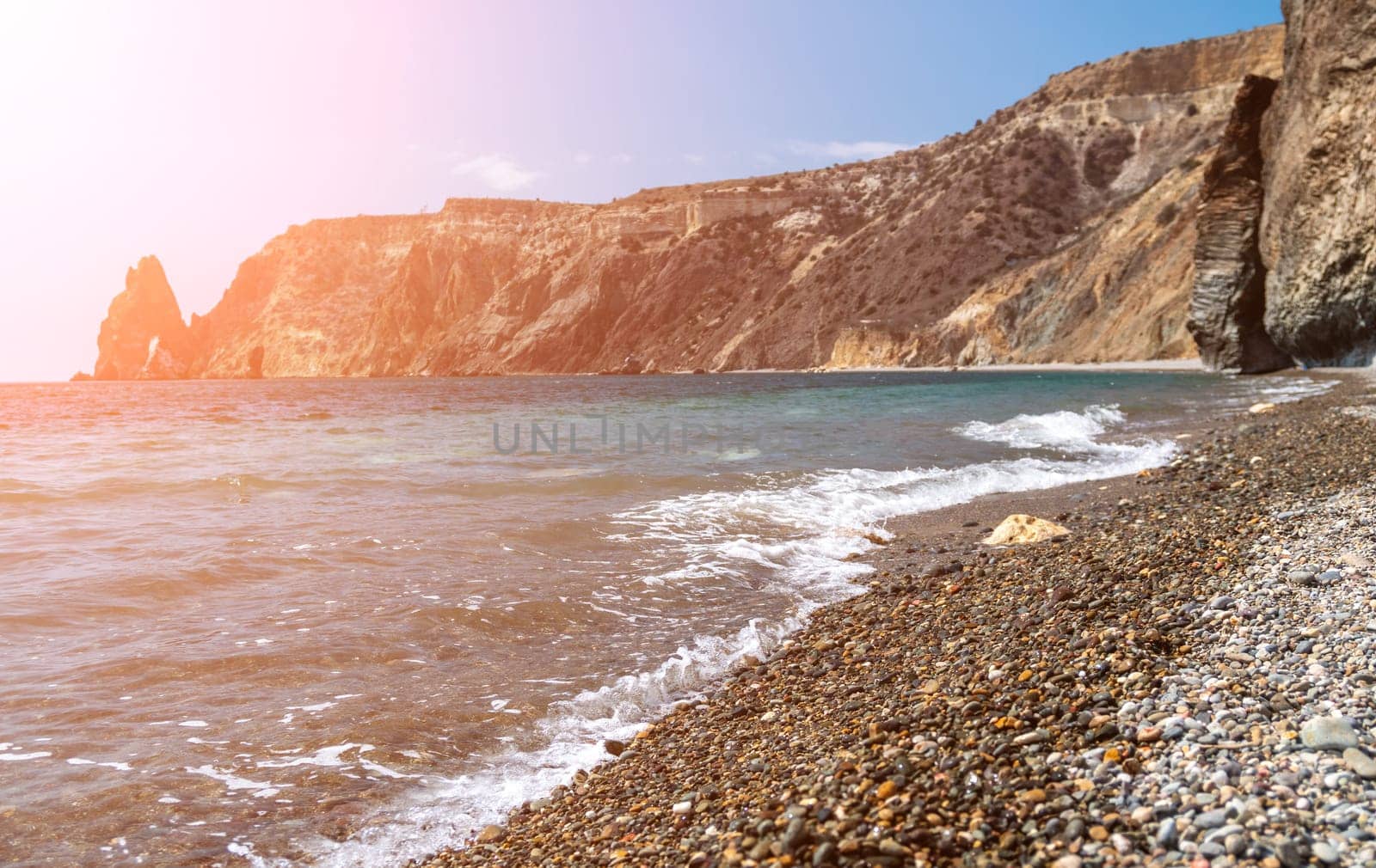 Abstract nature summer ocean sunset sea background. Small waves on water surface in motion blur with bokeh lights from sunrise. Holiday, vacation and recreational background concept by panophotograph