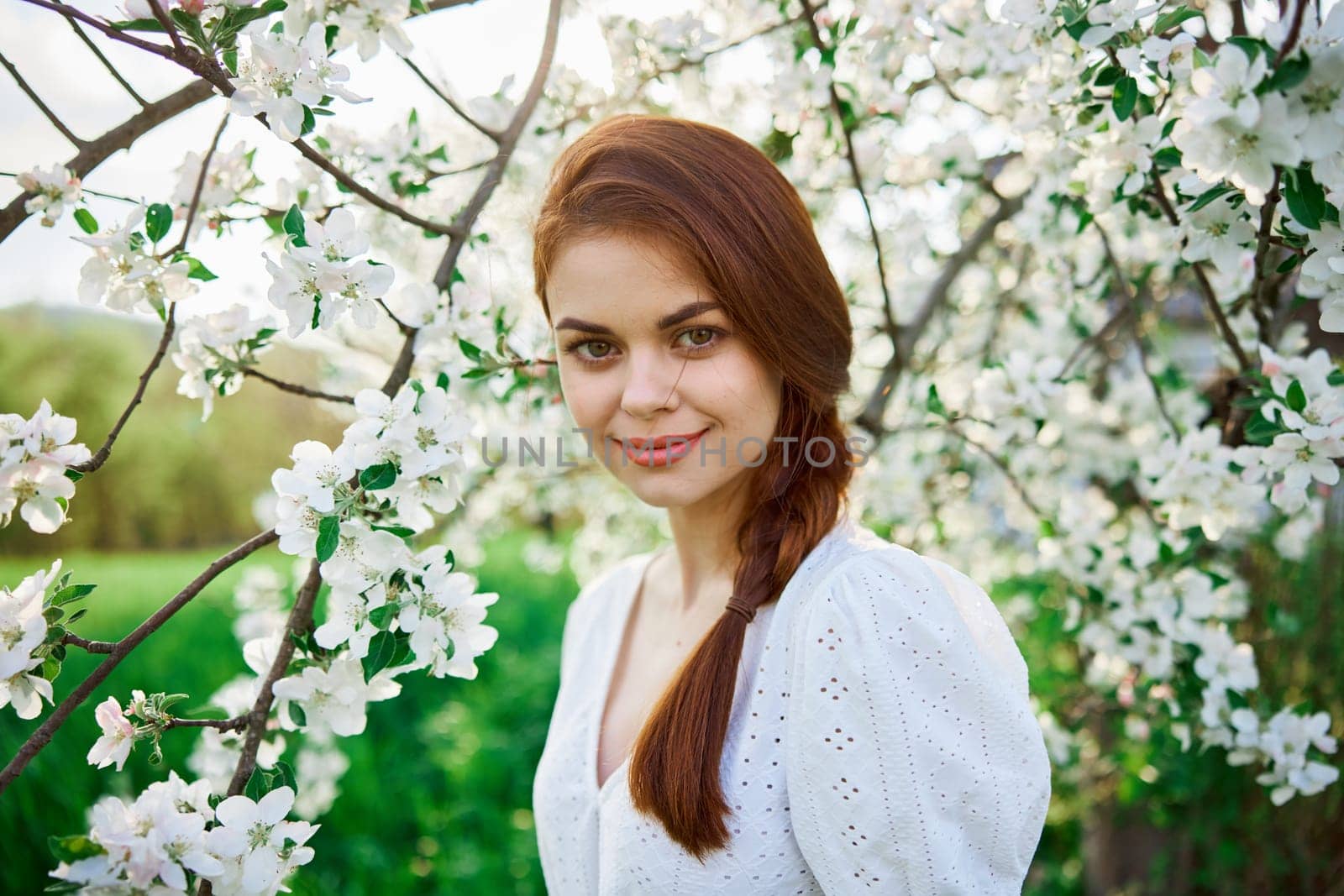 Spring woman in summer dress walking in park by Vichizh