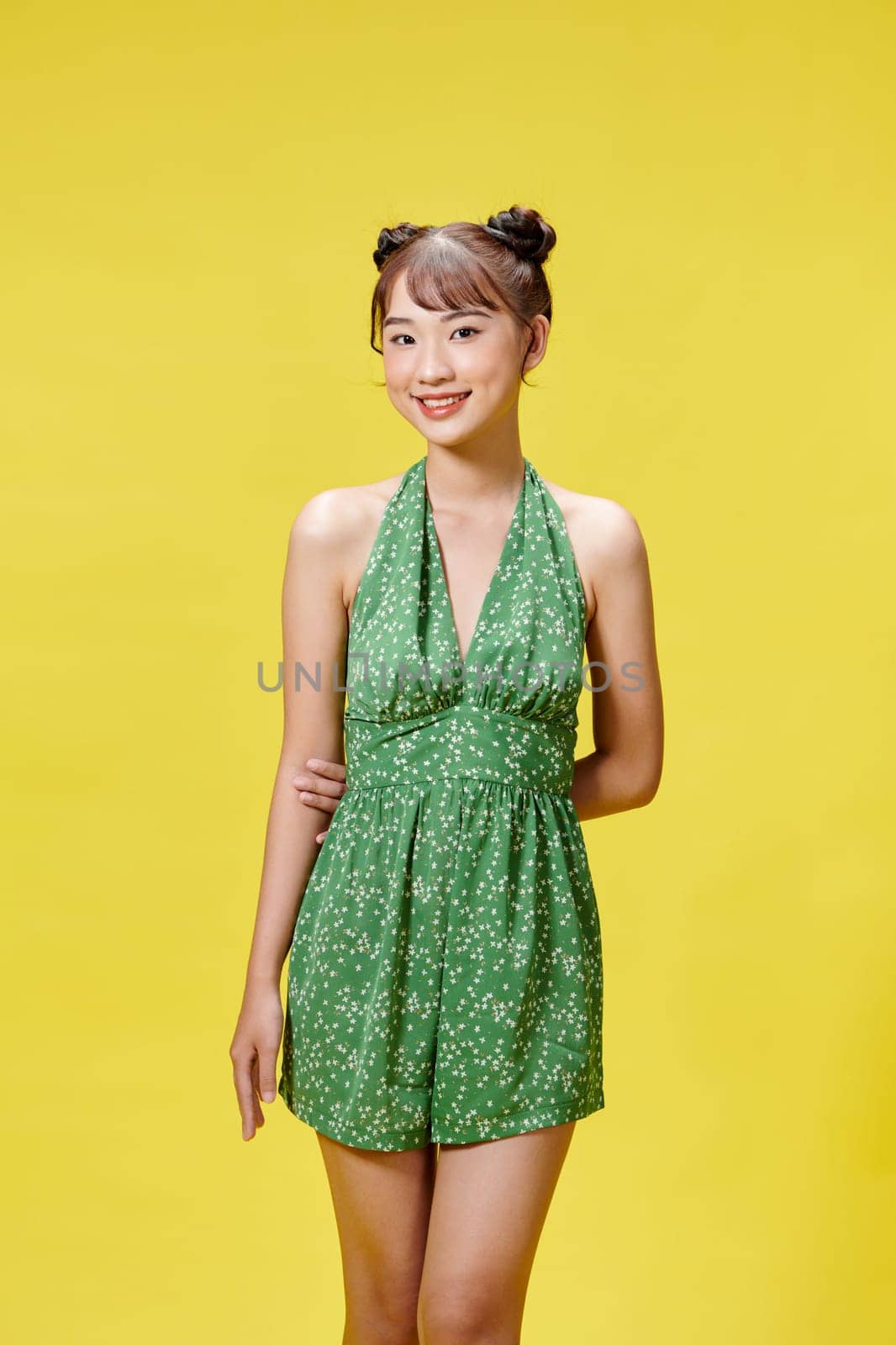 Portrait of young beautiful smiling female in trendy summer clothes.