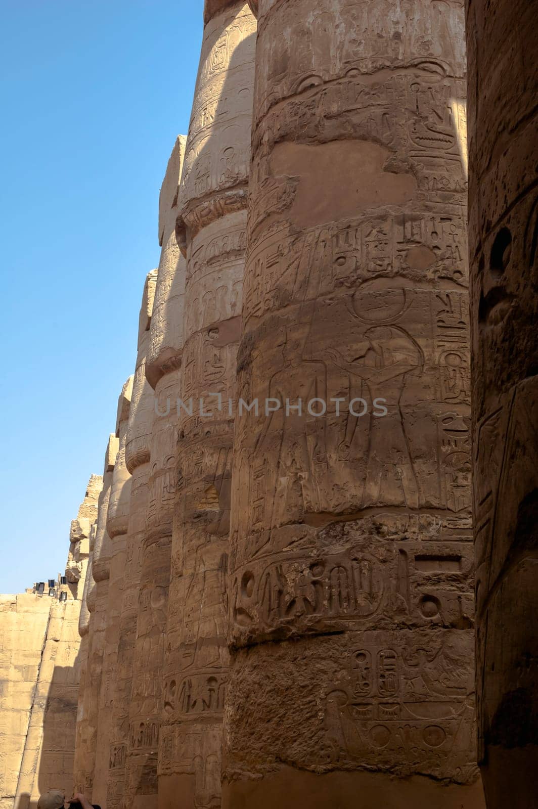 Luxor, Egypt - April 15 2008: Tourists visiting the Temple of Amun in Karnak complex, Luxor, Egypt