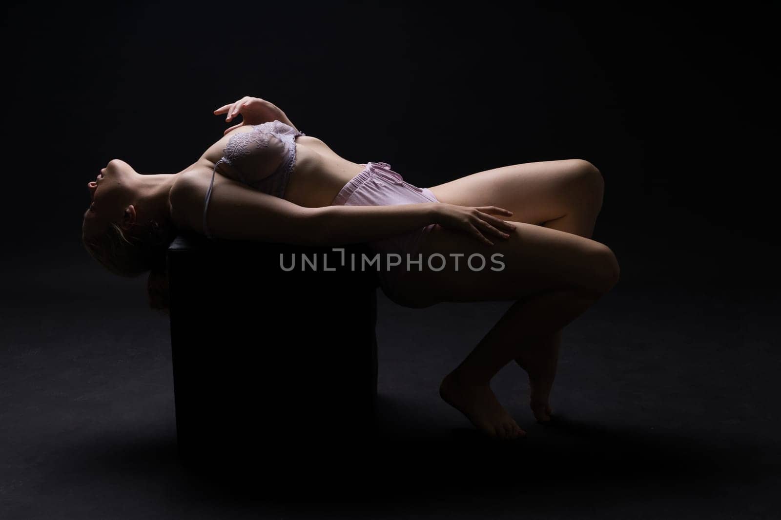 Topless sensual caucasian woman. On black background. by Zelenin