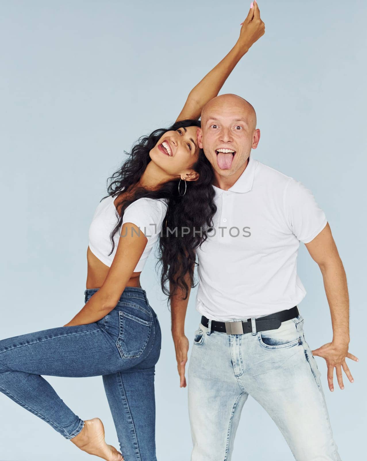 Gesturing and having fun. Cheerful couple is together indoors.