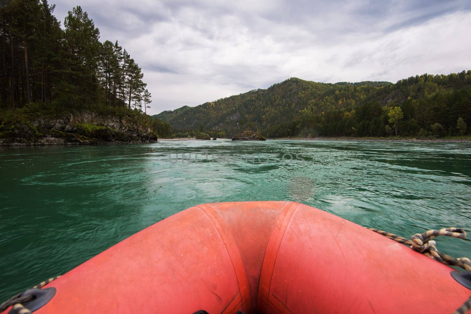 Rafting and boating on the Katun River in the Altai in Russia. First-person view.