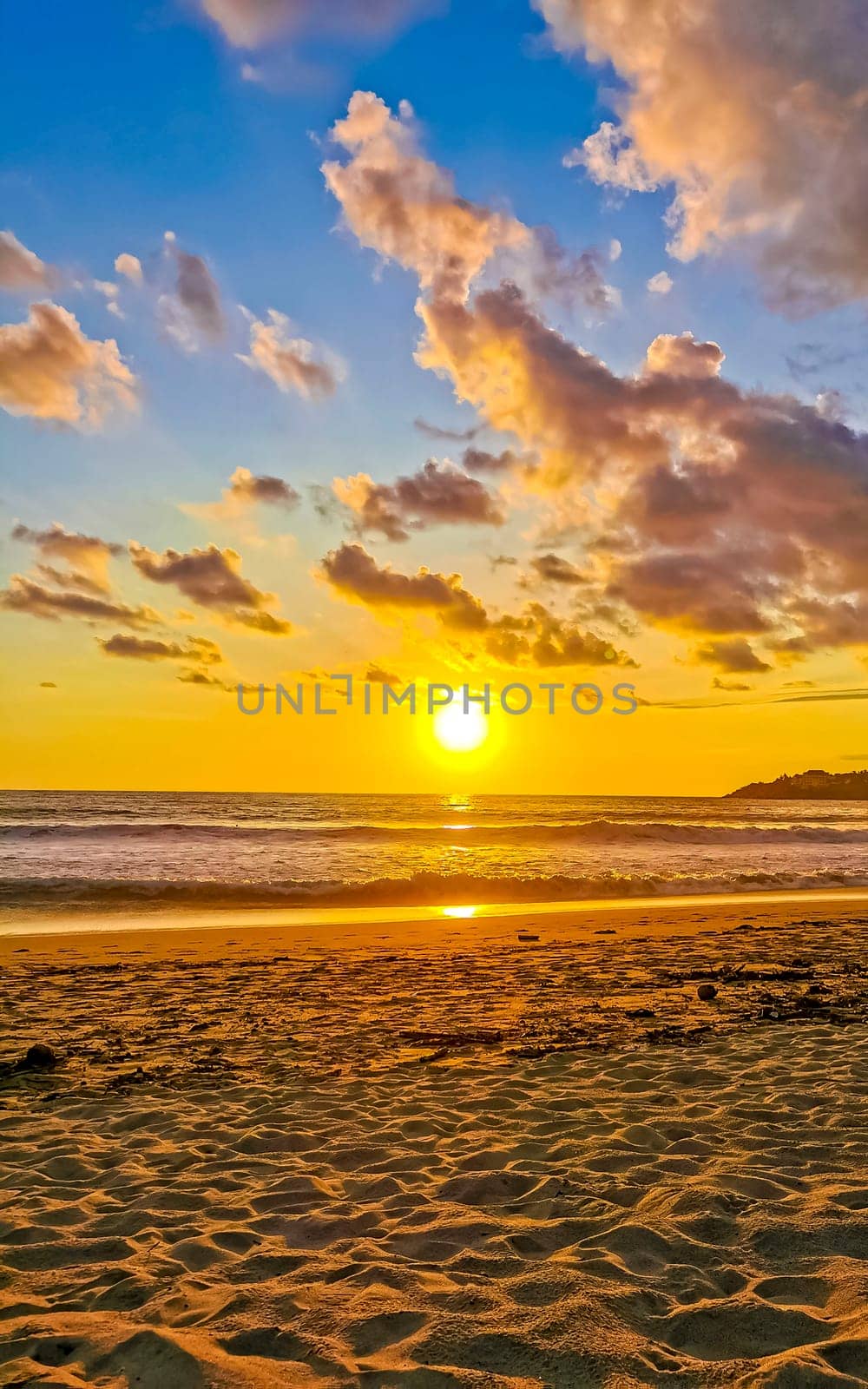 Colorful golden sunset big wave and beach Puerto Escondido Mexico. by Arkadij