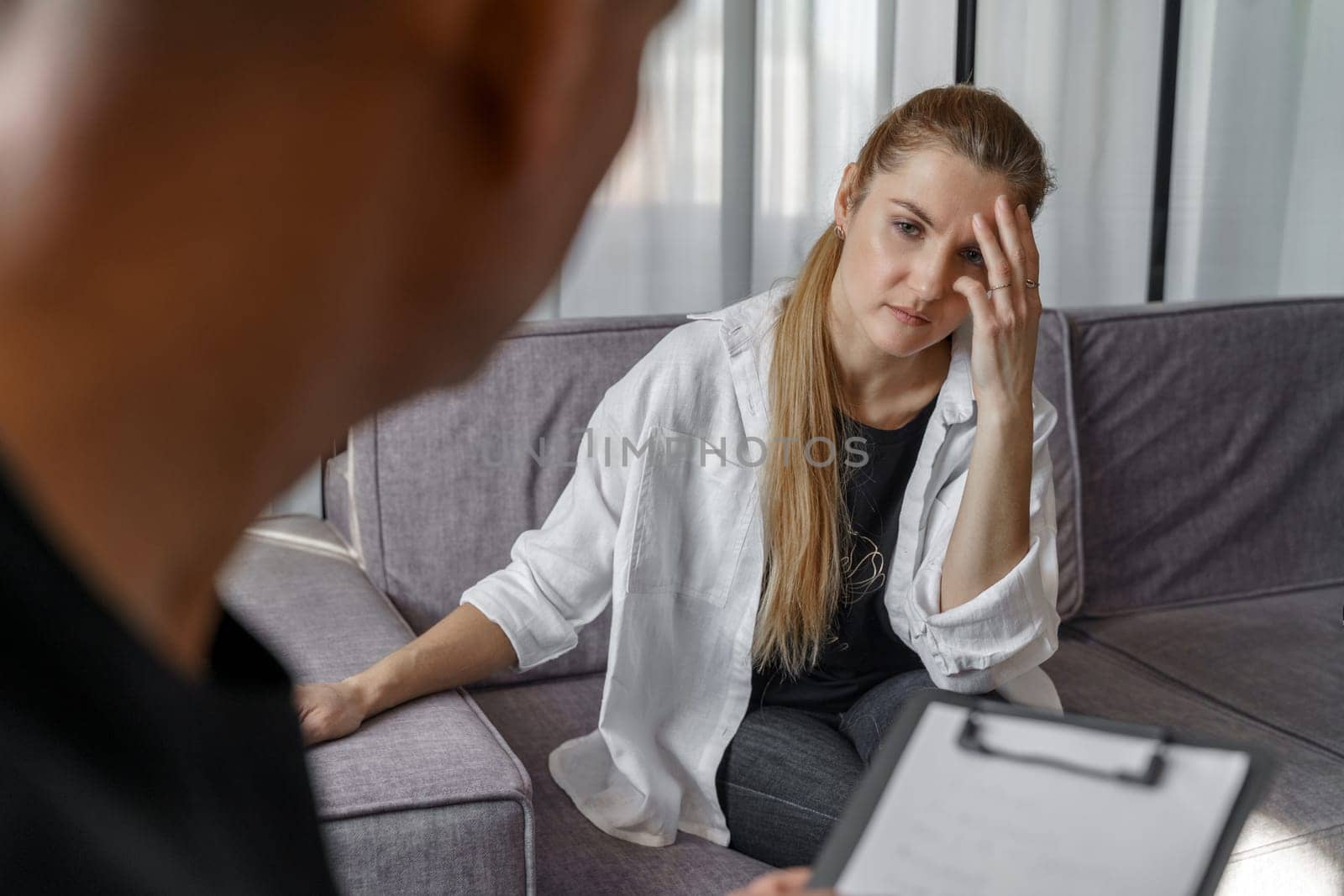 A male psychologist consults a female patient, makes notes. by Sd28DimoN_1976