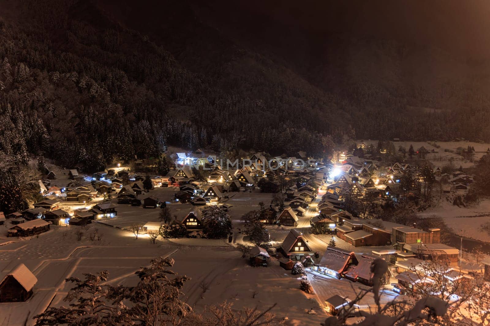 Shirakawa-go's isolated mountain village is a magical place on a snowy night, with its charming houses and beautiful lights.