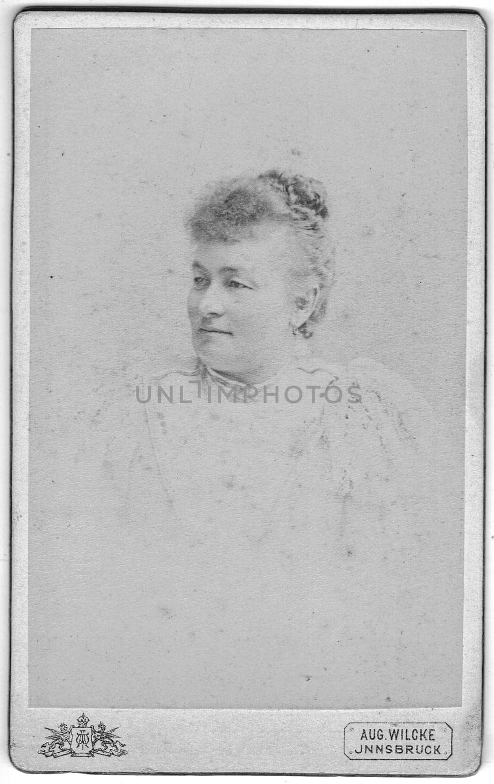 Vintage cabinet card shows portrait of older woman. Edwardian hairstyle and fashion. Photo was taken in a photo studio. Photo was taken in Austro-Hungarian Empire or also Austro-Hungarian Monarchy by roman_nerud