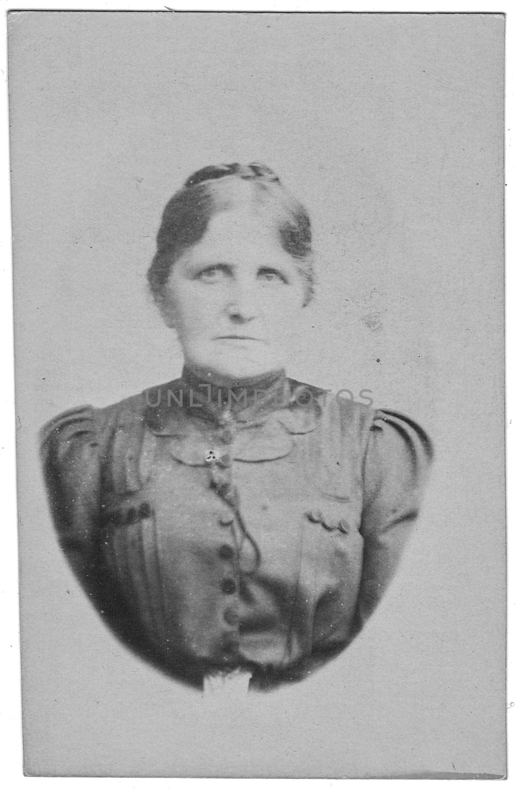 Vintage cabinet card shows portrait of the elderly woman. Edwardian fashion. Photo was taken in a photo studio. Photo was taken in Austro-Hungarian Empire or also Austro-Hungarian Monarchy by roman_nerud