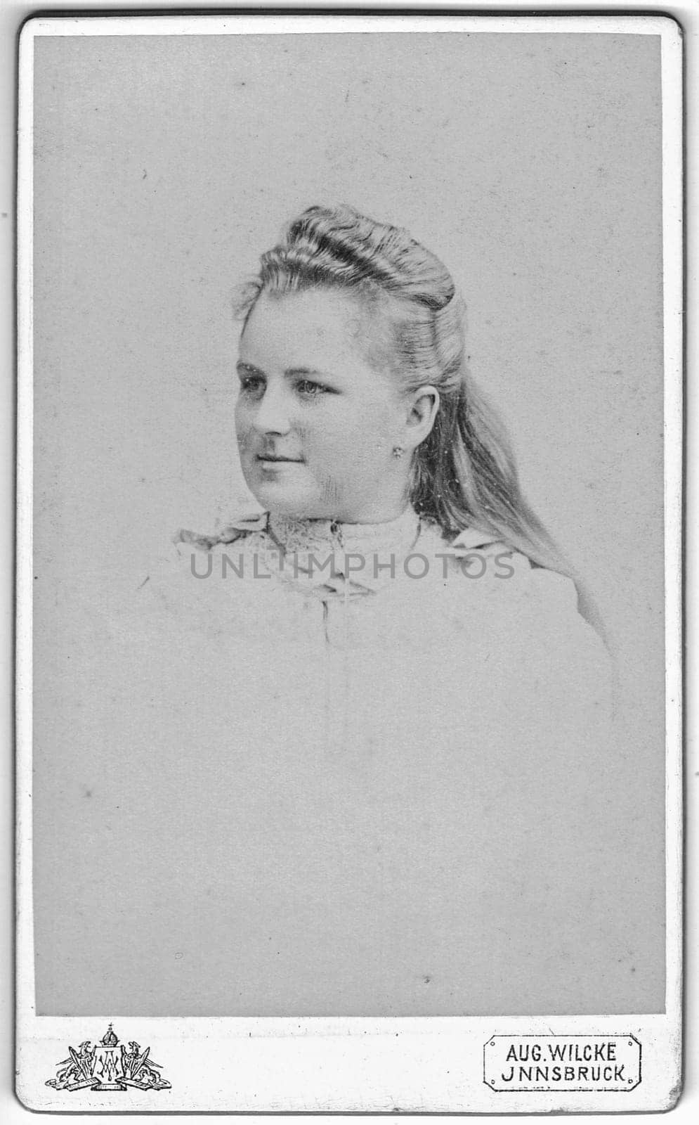JNNSBRUCK - INNSBRUCK, AUSTRIA - HUNGARY - CIRCA 1910: Vintage cabinet card shows portrait of the middle-aged woman. Photo was taken in a photo studio. Edwardian hairstyle. Photo was taken in Austro-Hungarian Empire or also Austro-Hungarian Monarchy.