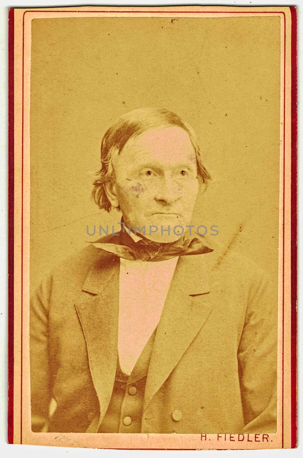 Vintage cabinet card shows portrait of the elderly man. Photo was taken in a photo studio. Edwardian era. Photo was taken in Austro-Hungarian Empire or also Austro-Hungarian Monarchy by roman_nerud